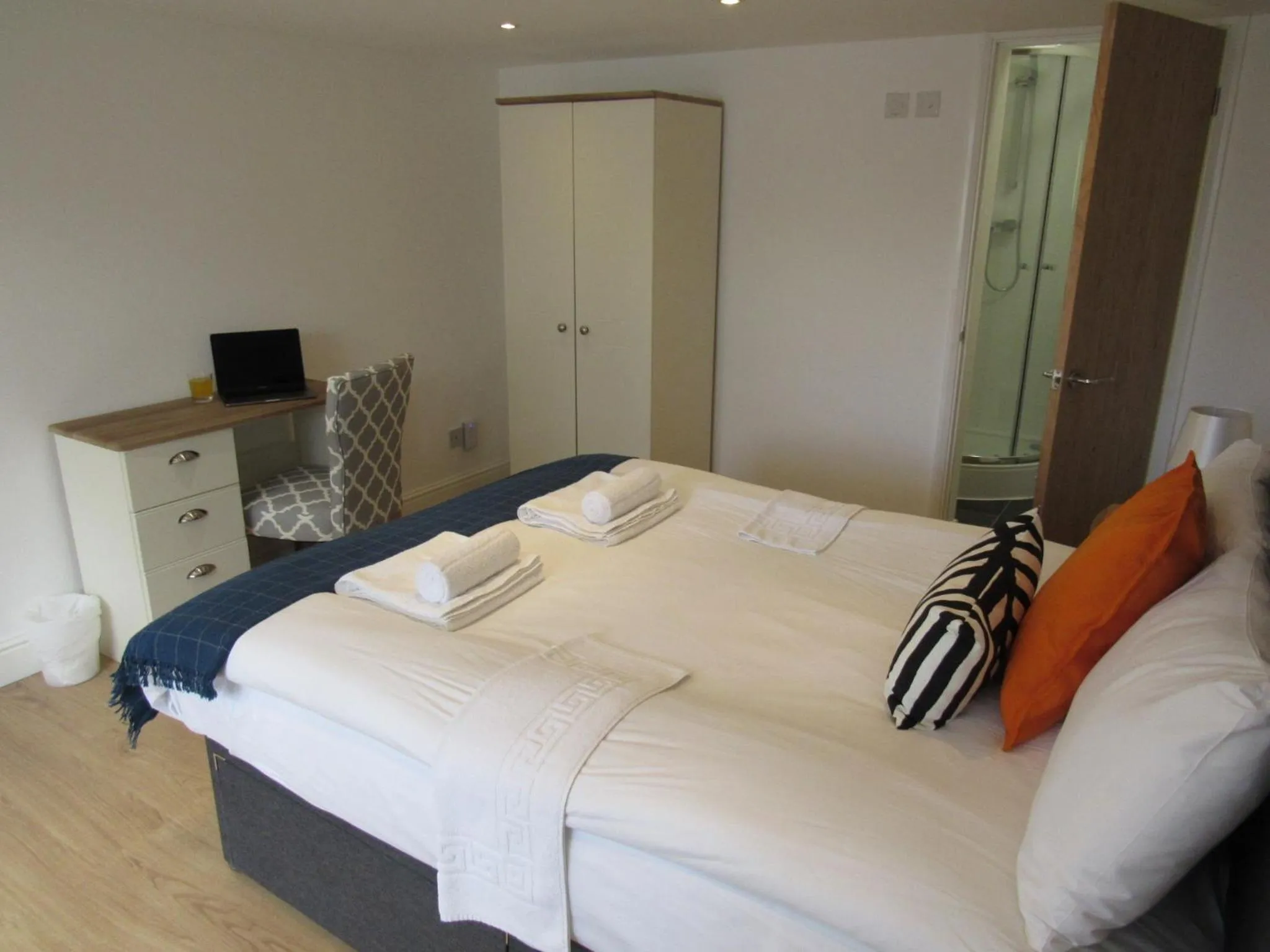 Bed in The Cambridge Suites - Tas Accommodations