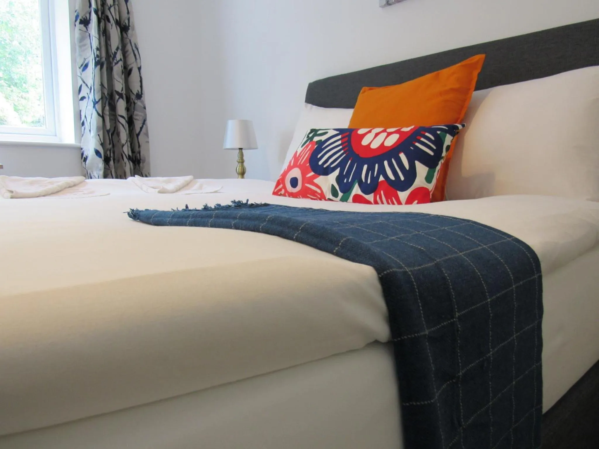 Bed in The Cambridge Suites - Tas Accommodations