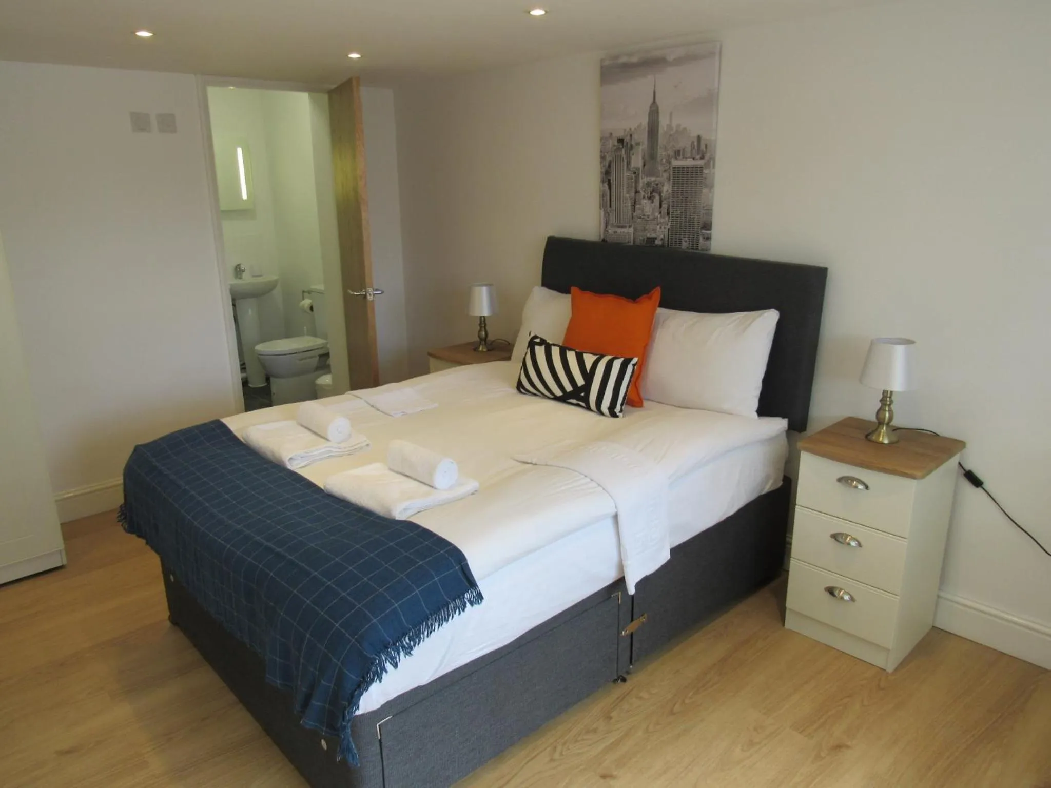 Bed in The Cambridge Suites - Tas Accommodations