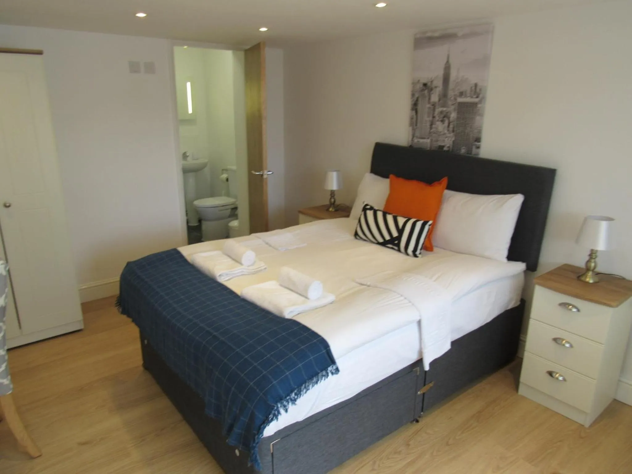 Bed in The Cambridge Suites - Tas Accommodations