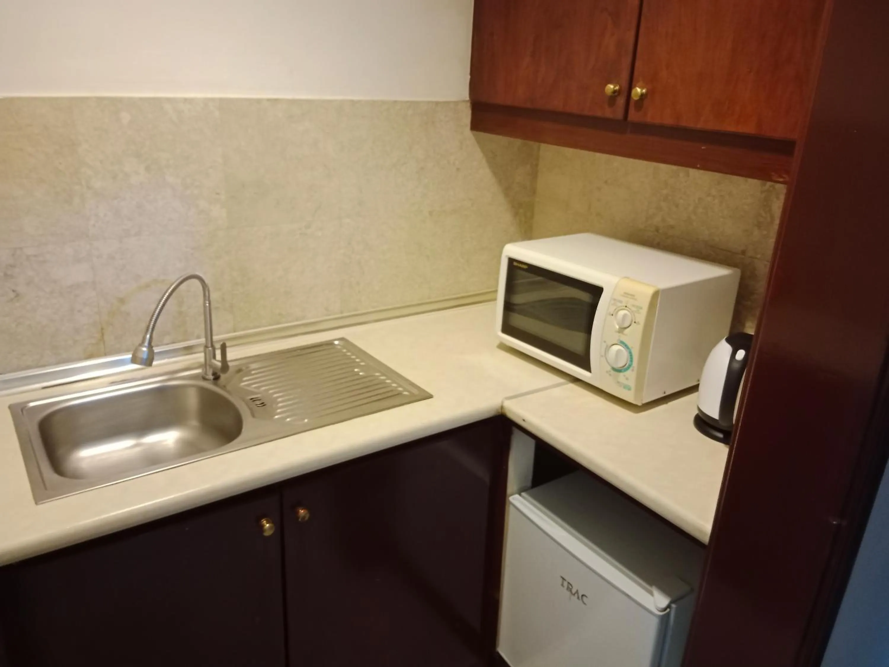 Kitchen or kitchenette in KL Universal Suites at Times Square