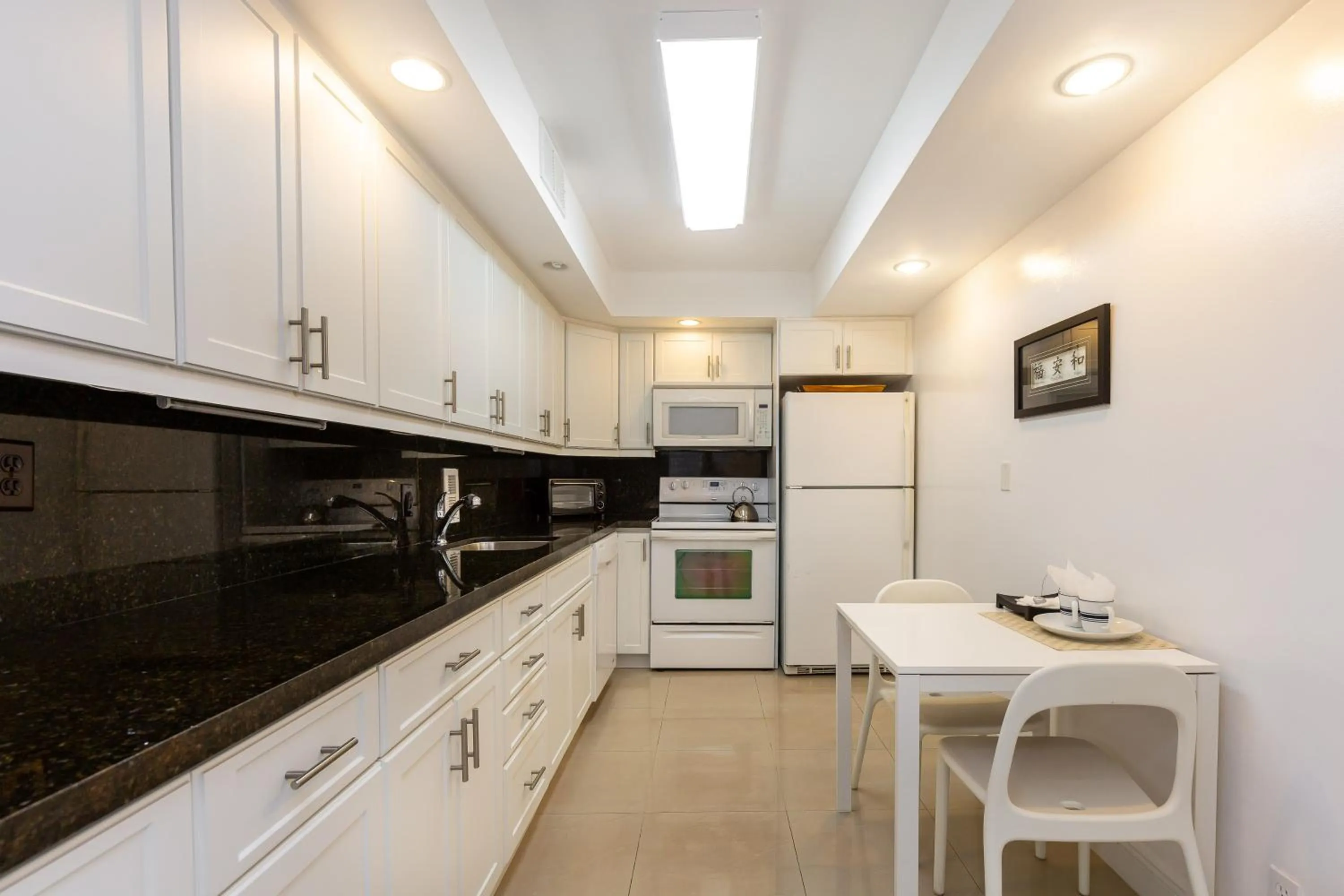 Kitchen or kitchenette in The Tides Ocean Luxury Suites