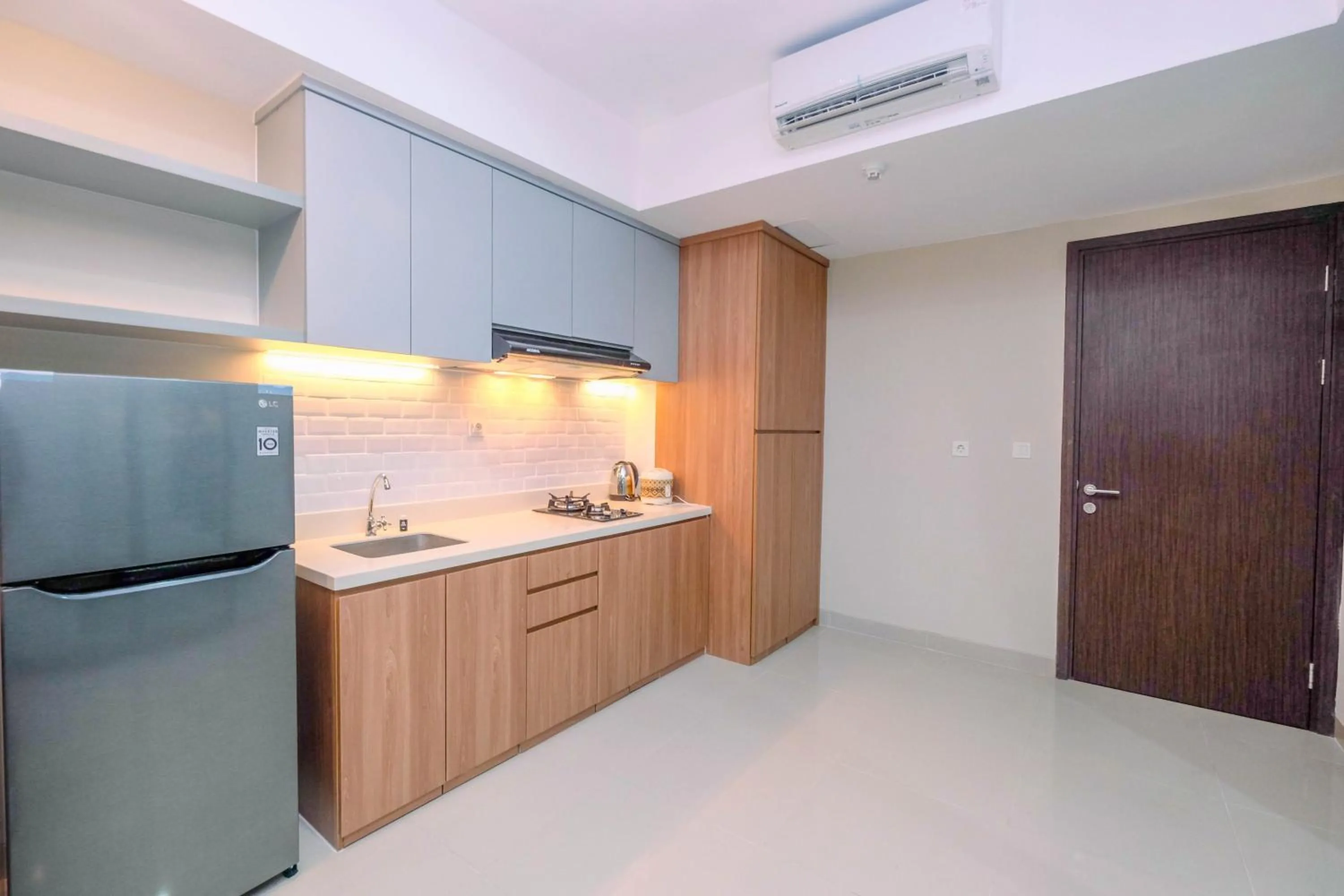 Cozy 2BR Apartment Nine Residence with City View By Travelio