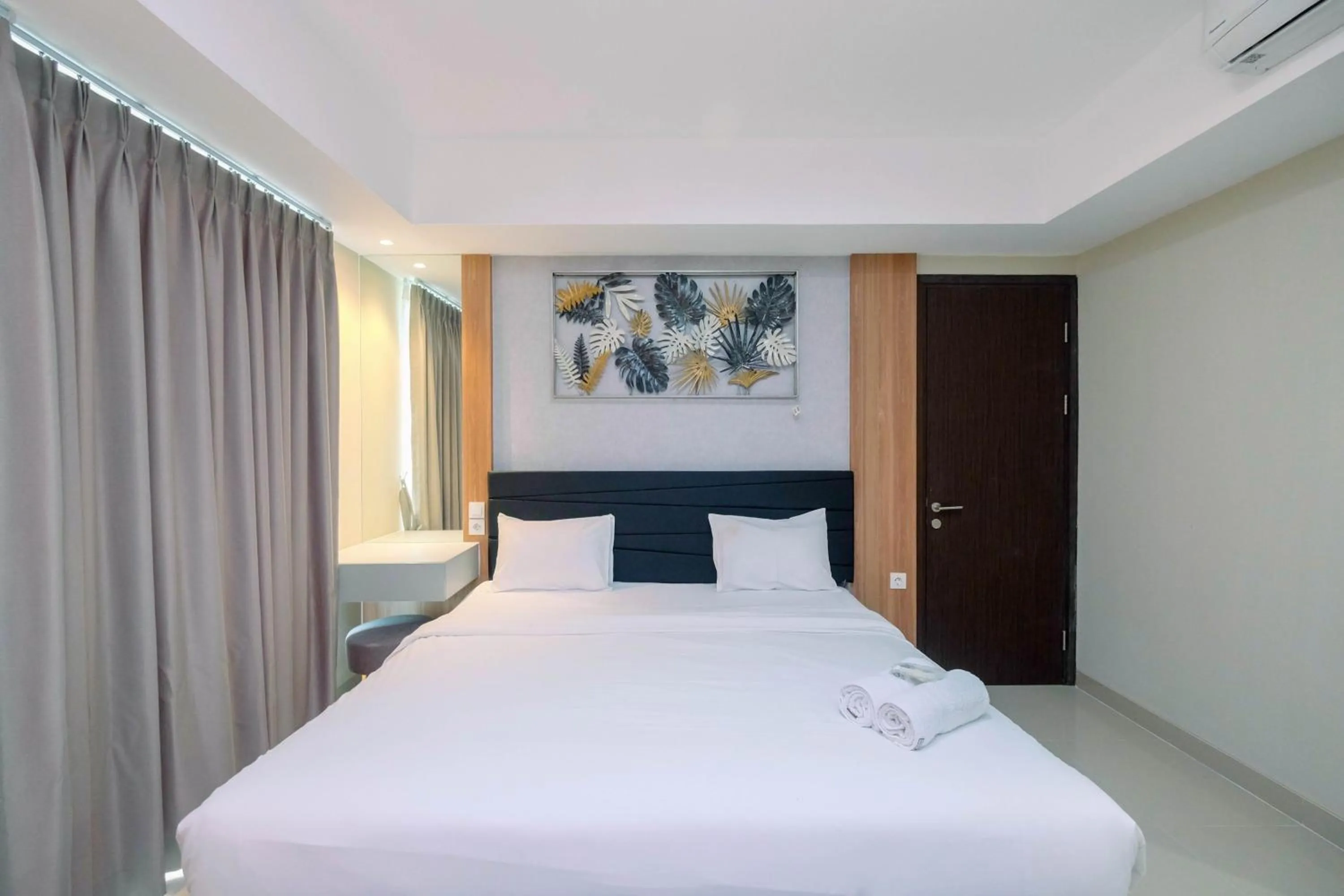 Bed in Cozy 2BR Apartment Nine Residence with City View By Travelio