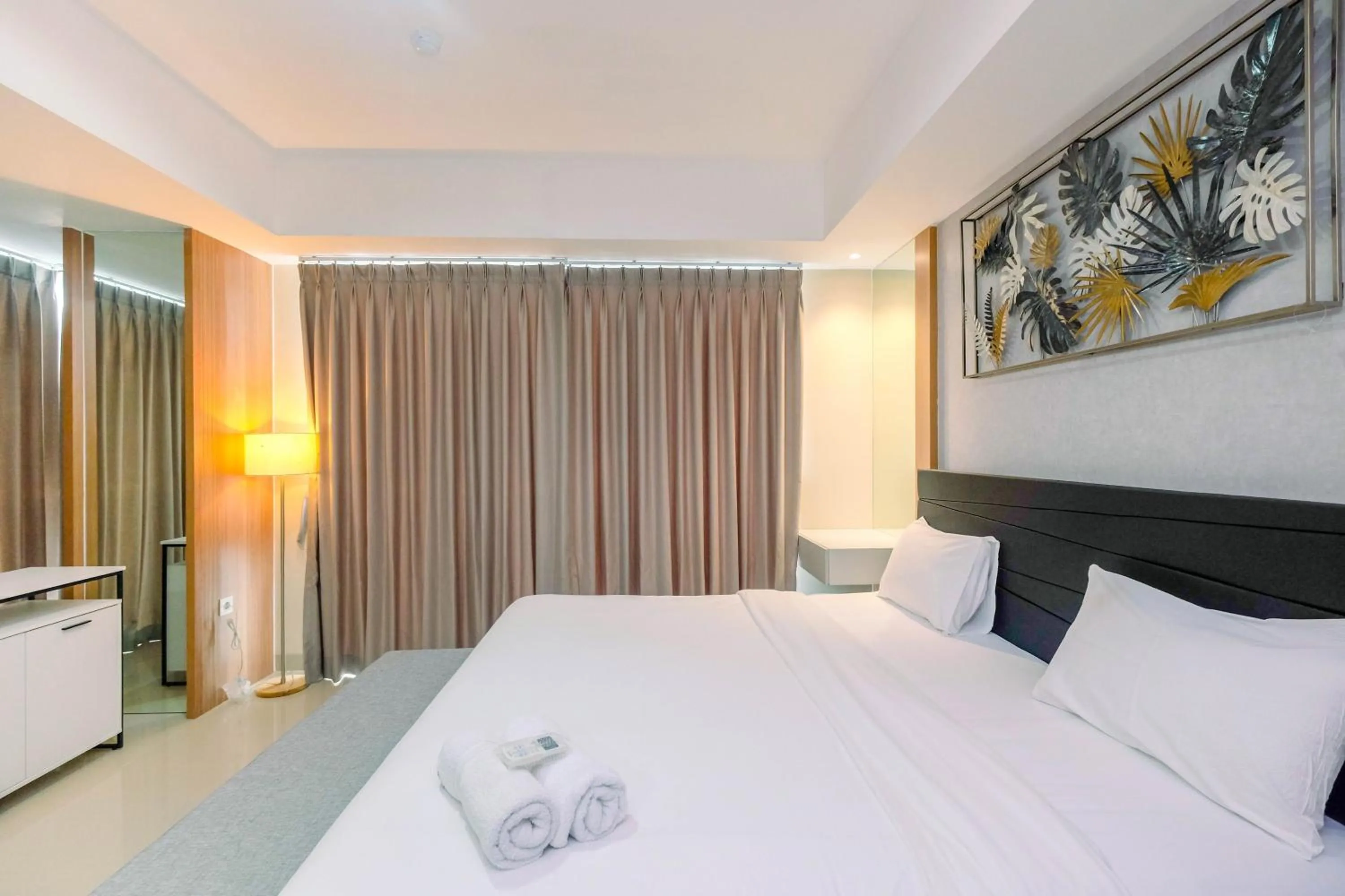 Bed in Cozy 2BR Apartment Nine Residence with City View By Travelio