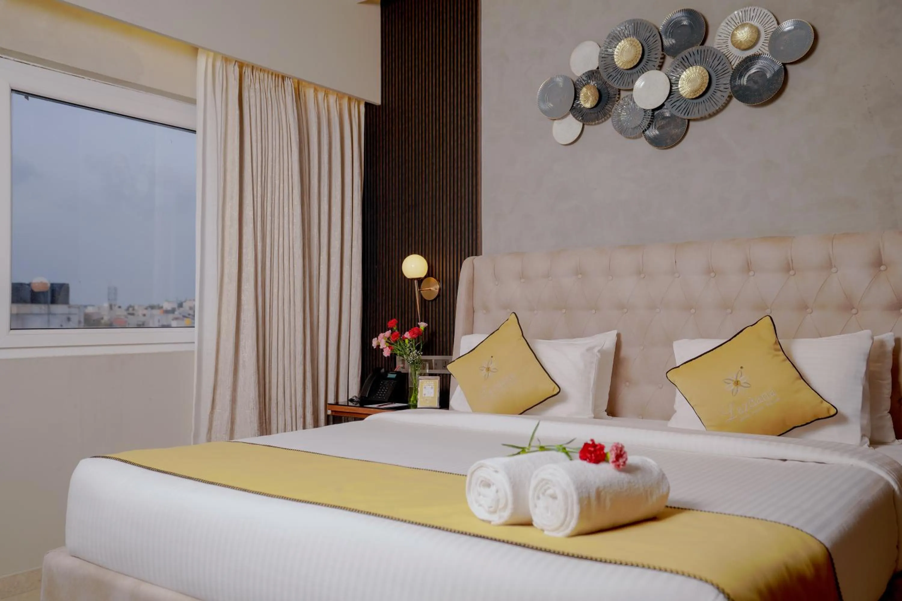 Bed in Lazdana Hotel Bangalore