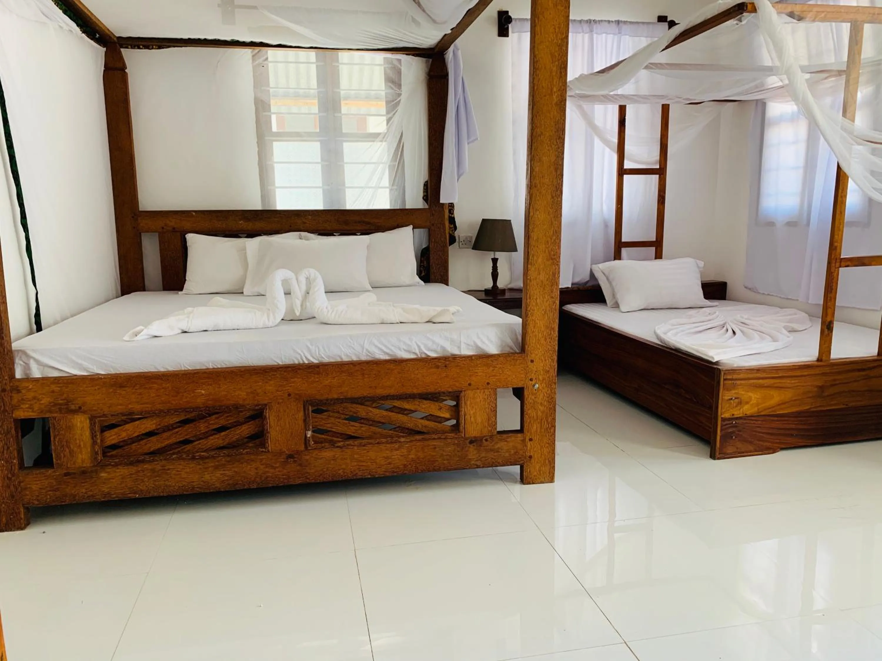 Photo of the whole room, Bed in Zava Nungwi