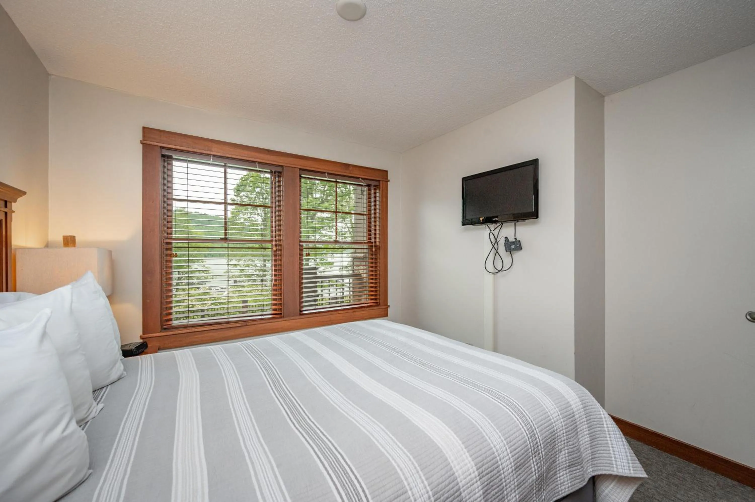 Bed in A115 One Bedroom Lake View