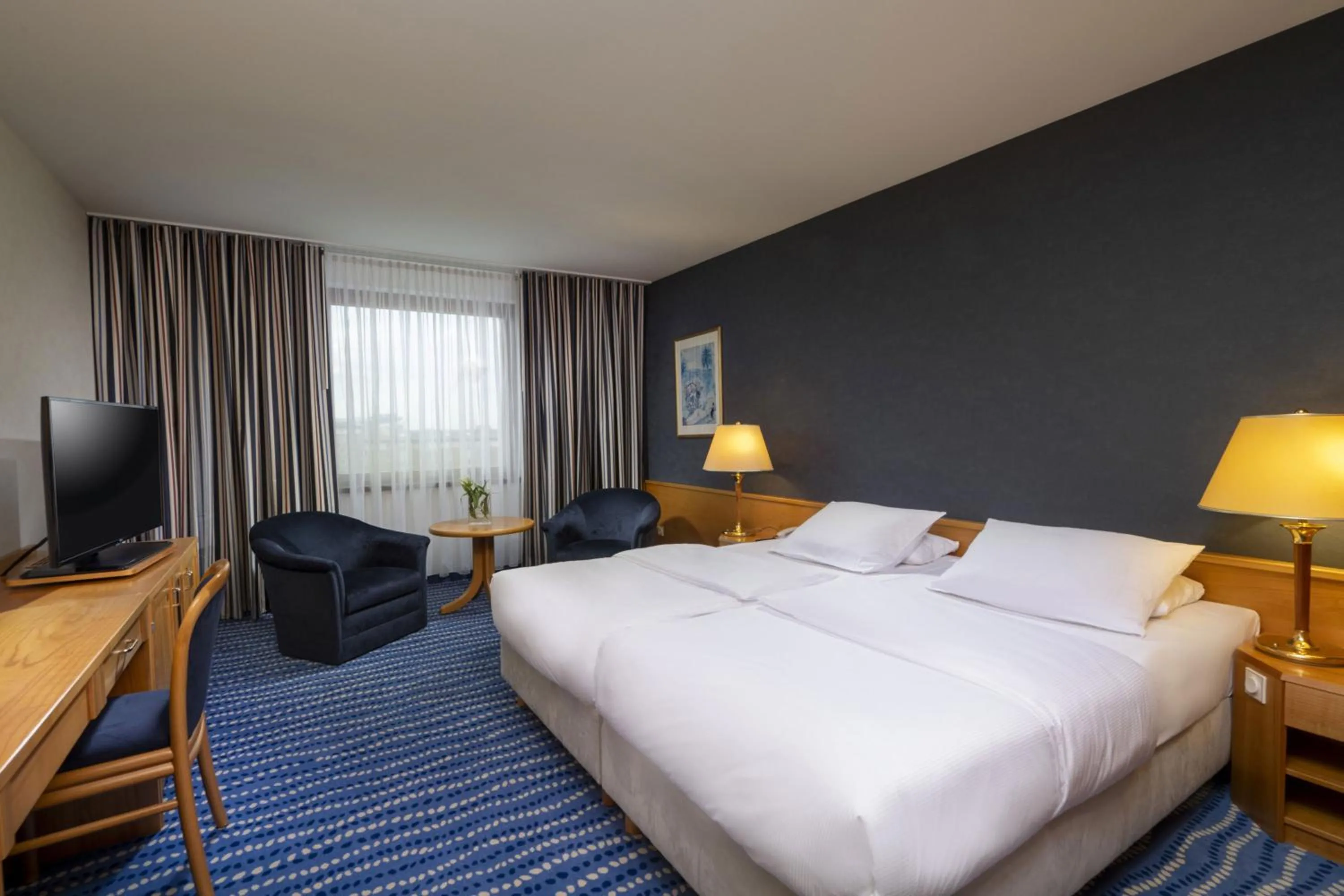 Photo of the whole room, Bed in Maritim Hotel Magdeburg