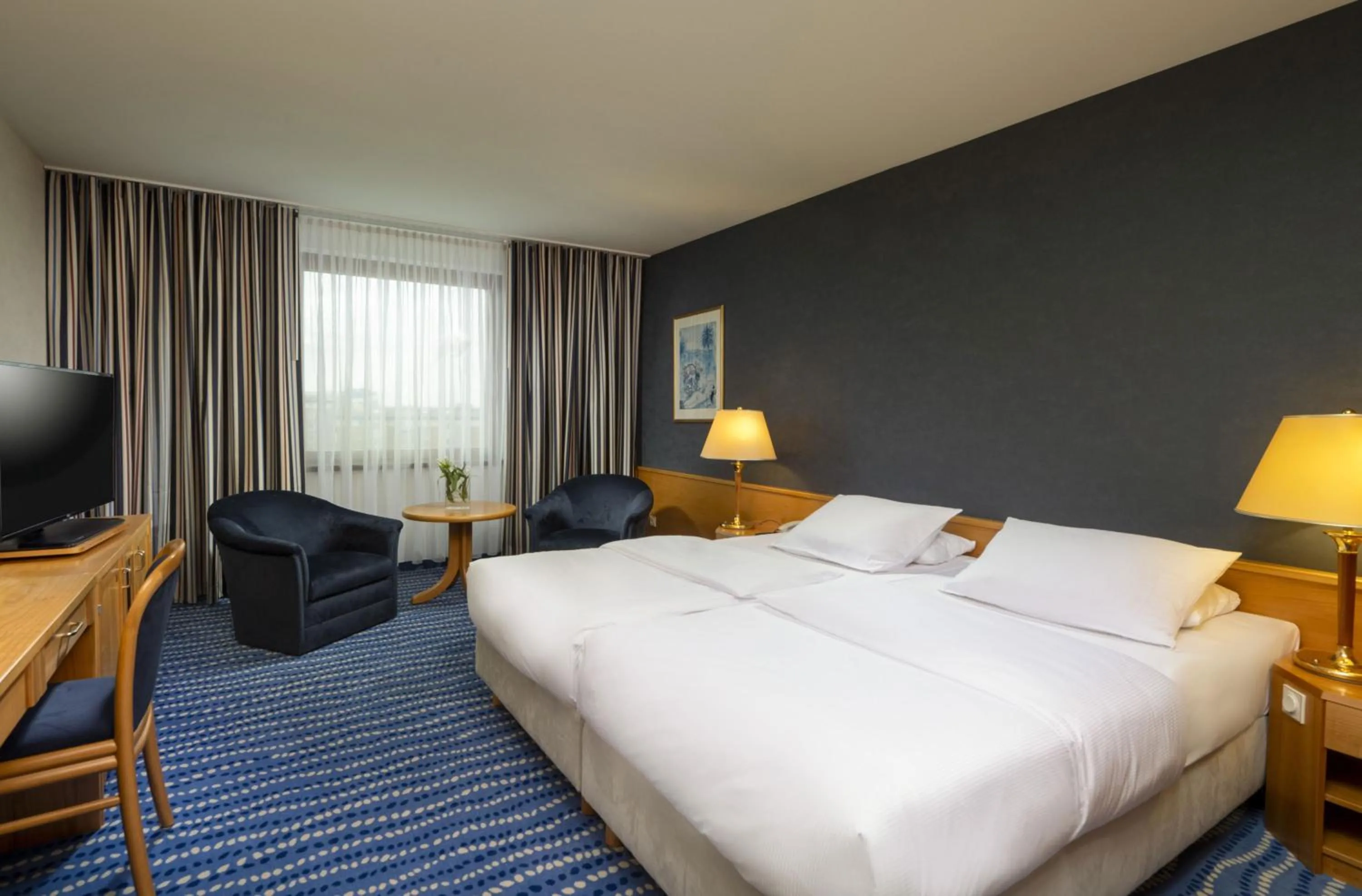 Photo of the whole room, Bed in Maritim Hotel Magdeburg