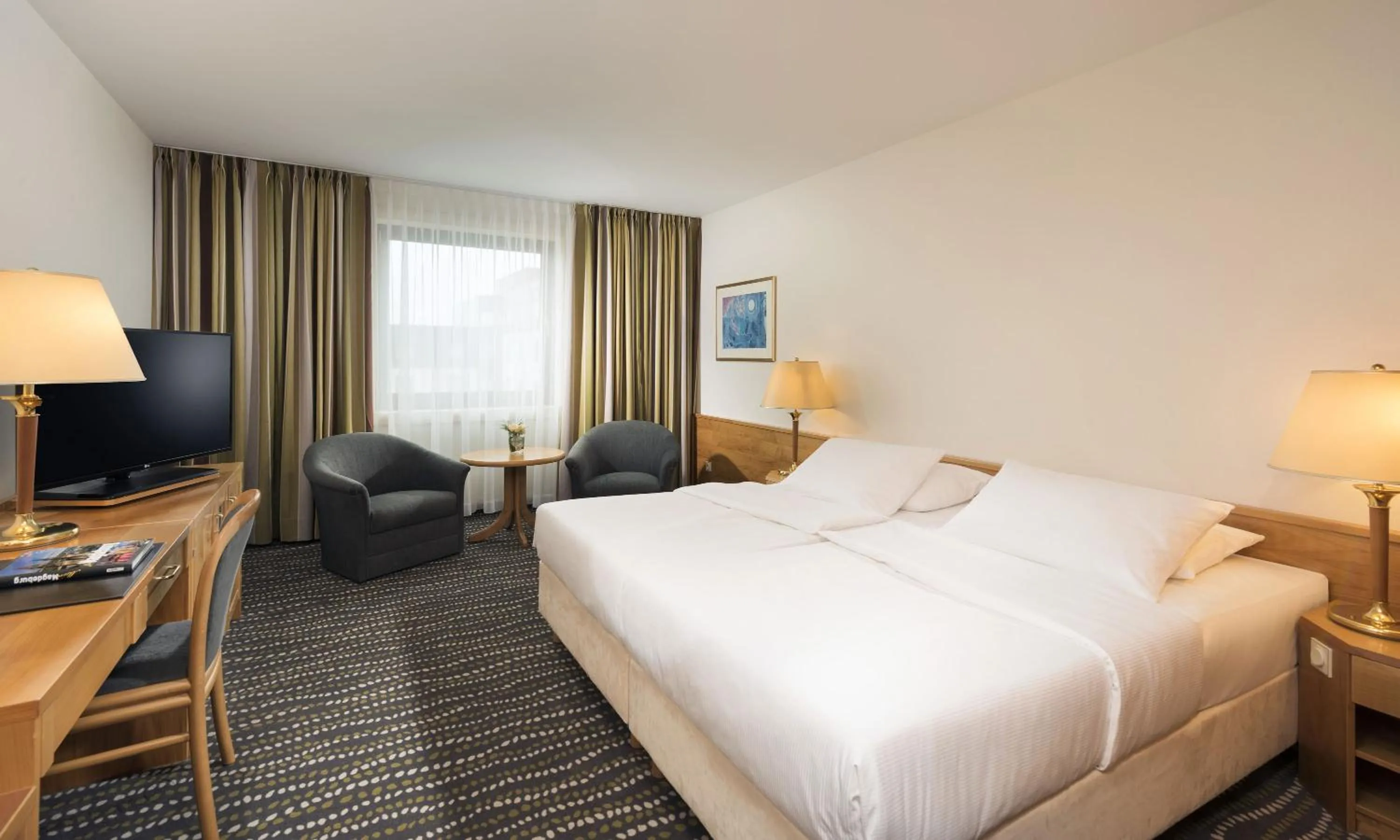 Photo of the whole room, Bed in Maritim Hotel Magdeburg