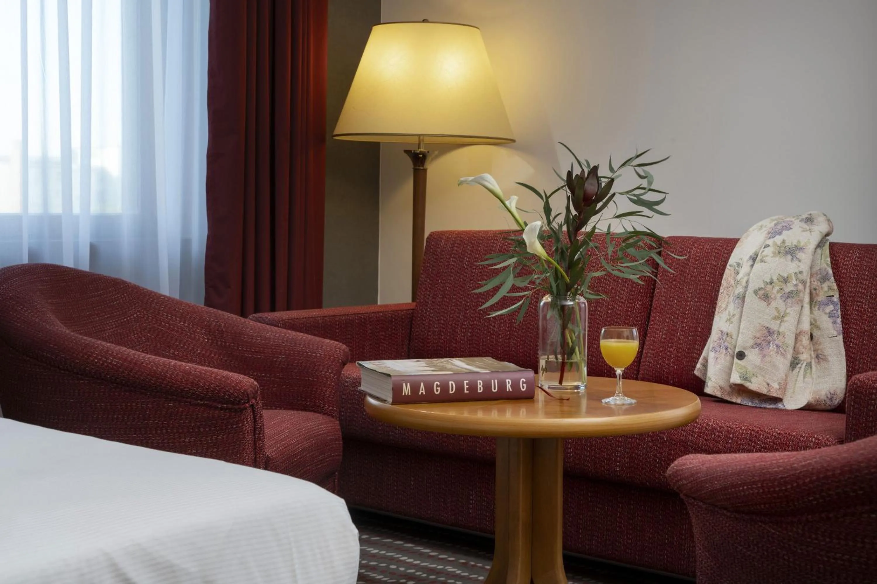 Seating area, Bed in Maritim Hotel Magdeburg