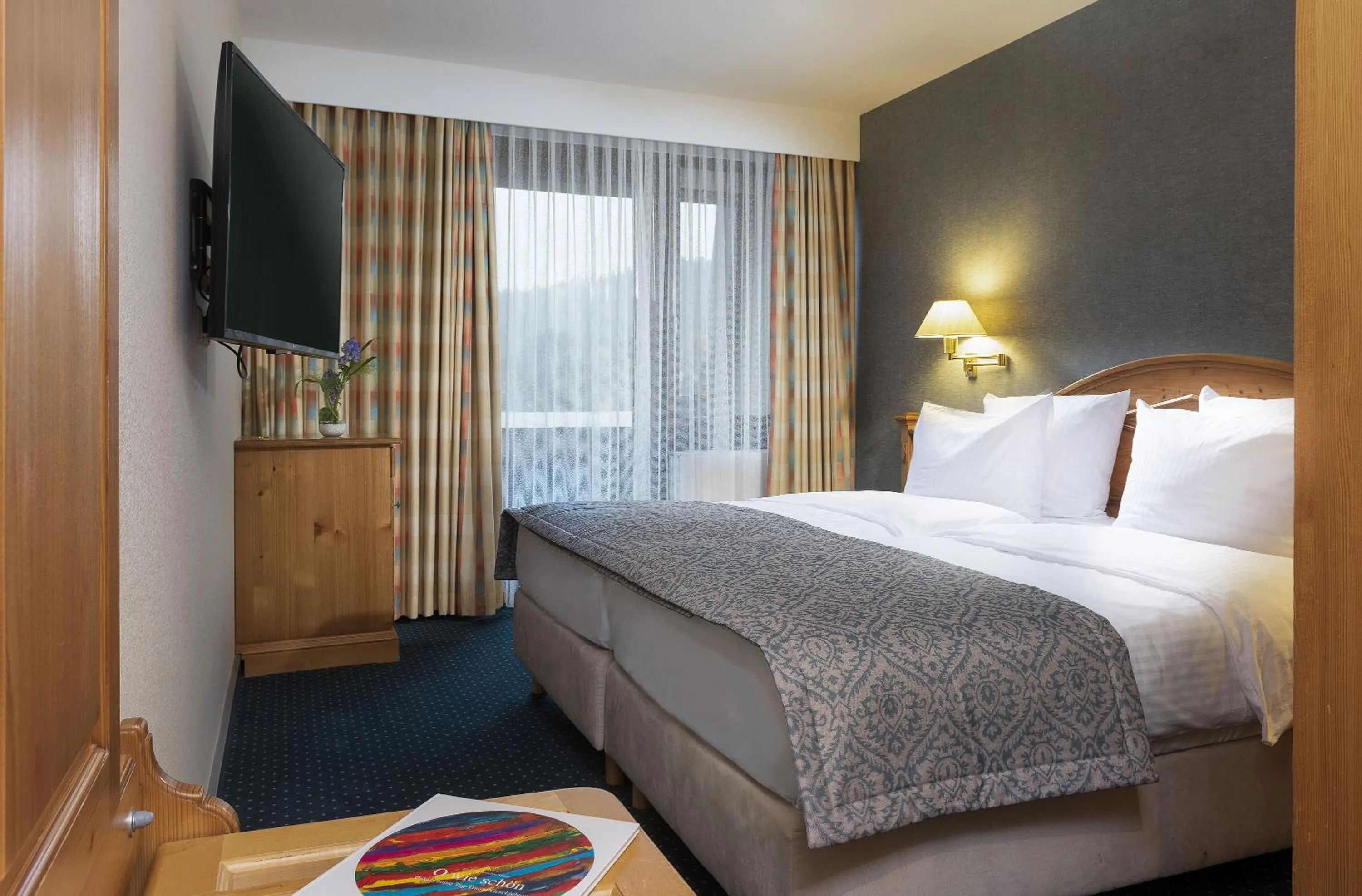 Photo of the whole room, Bed in Maritim Titisee Hotel