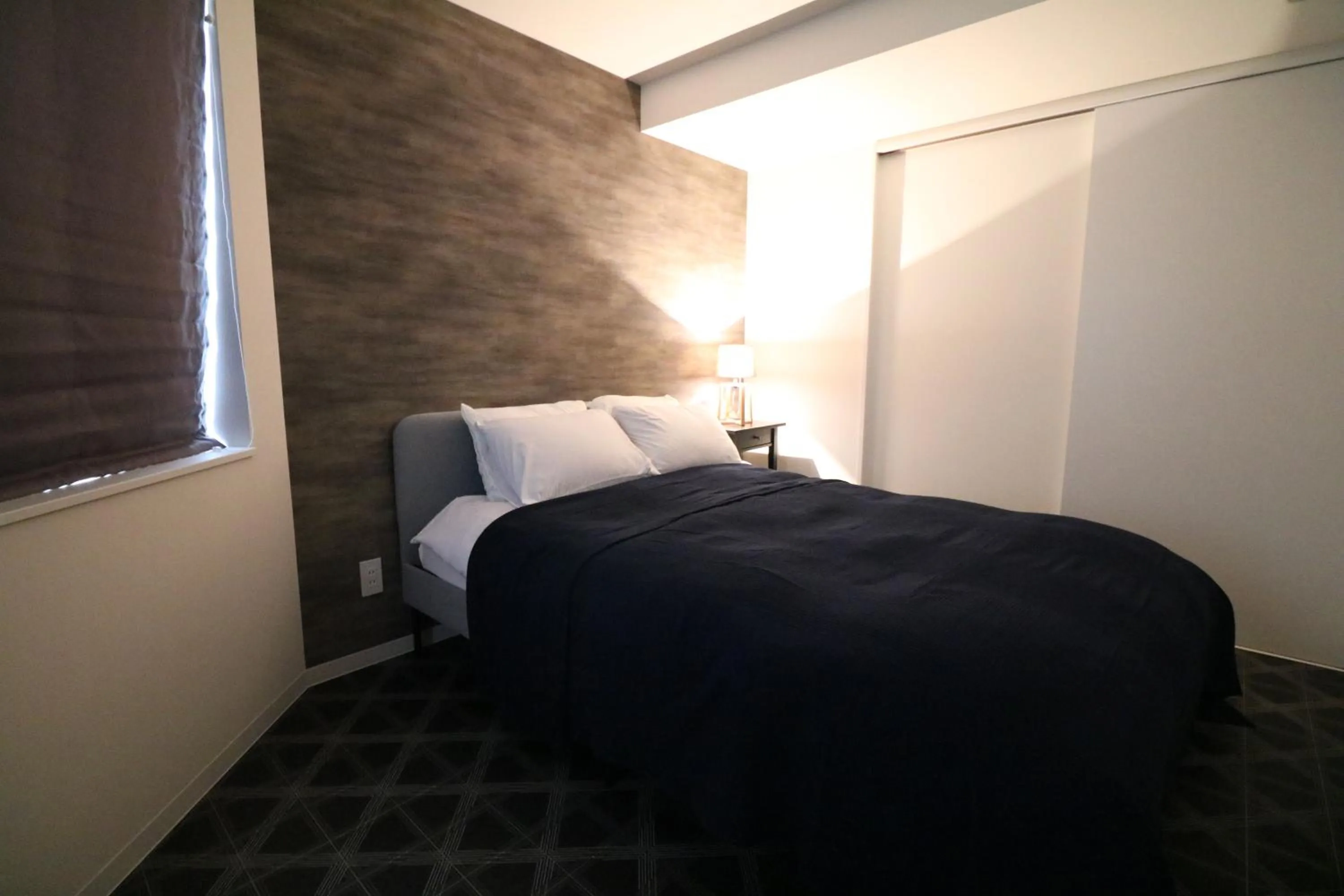 Bed in TAKETO STAY Kotoni