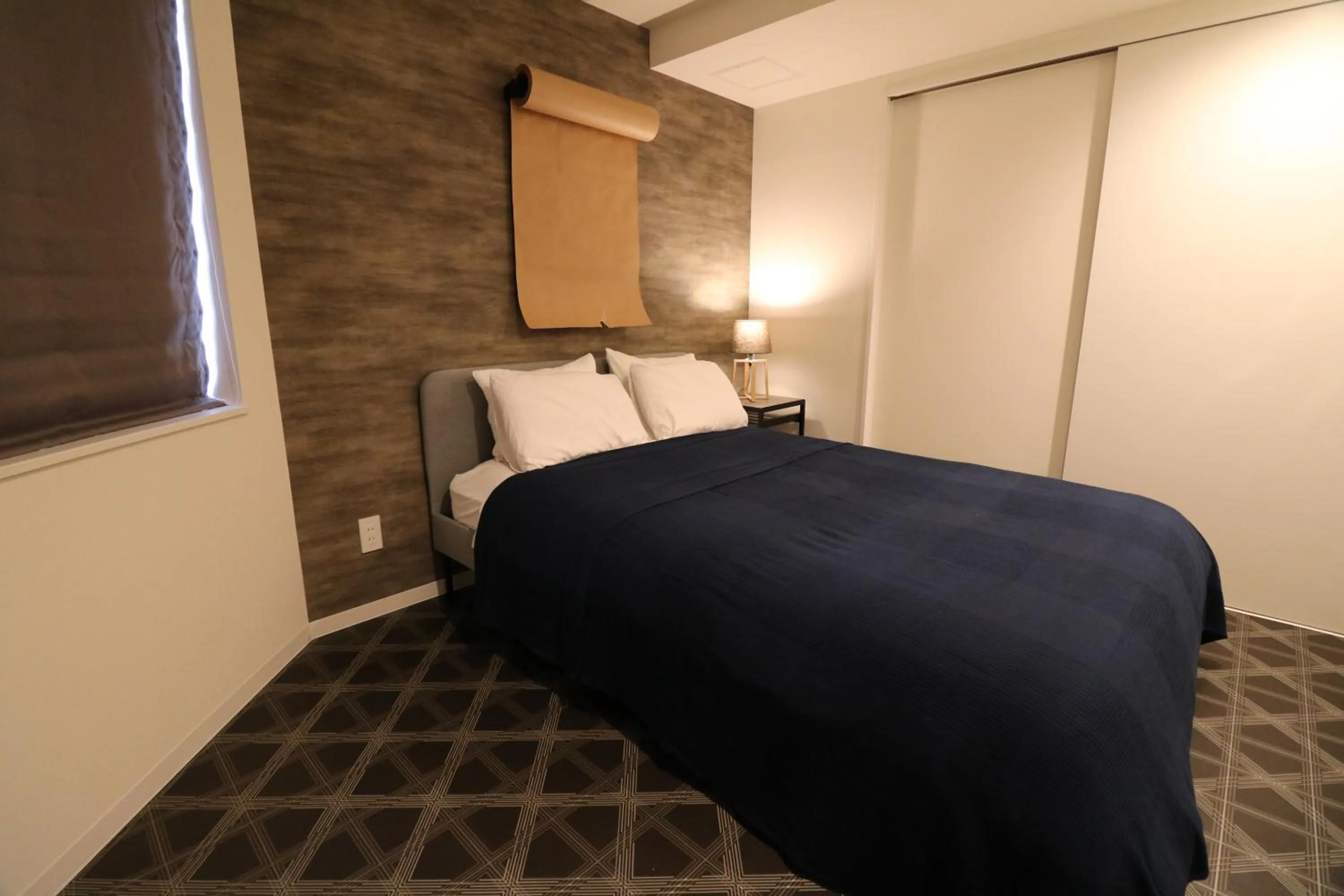 Bed in TAKETO STAY Kotoni