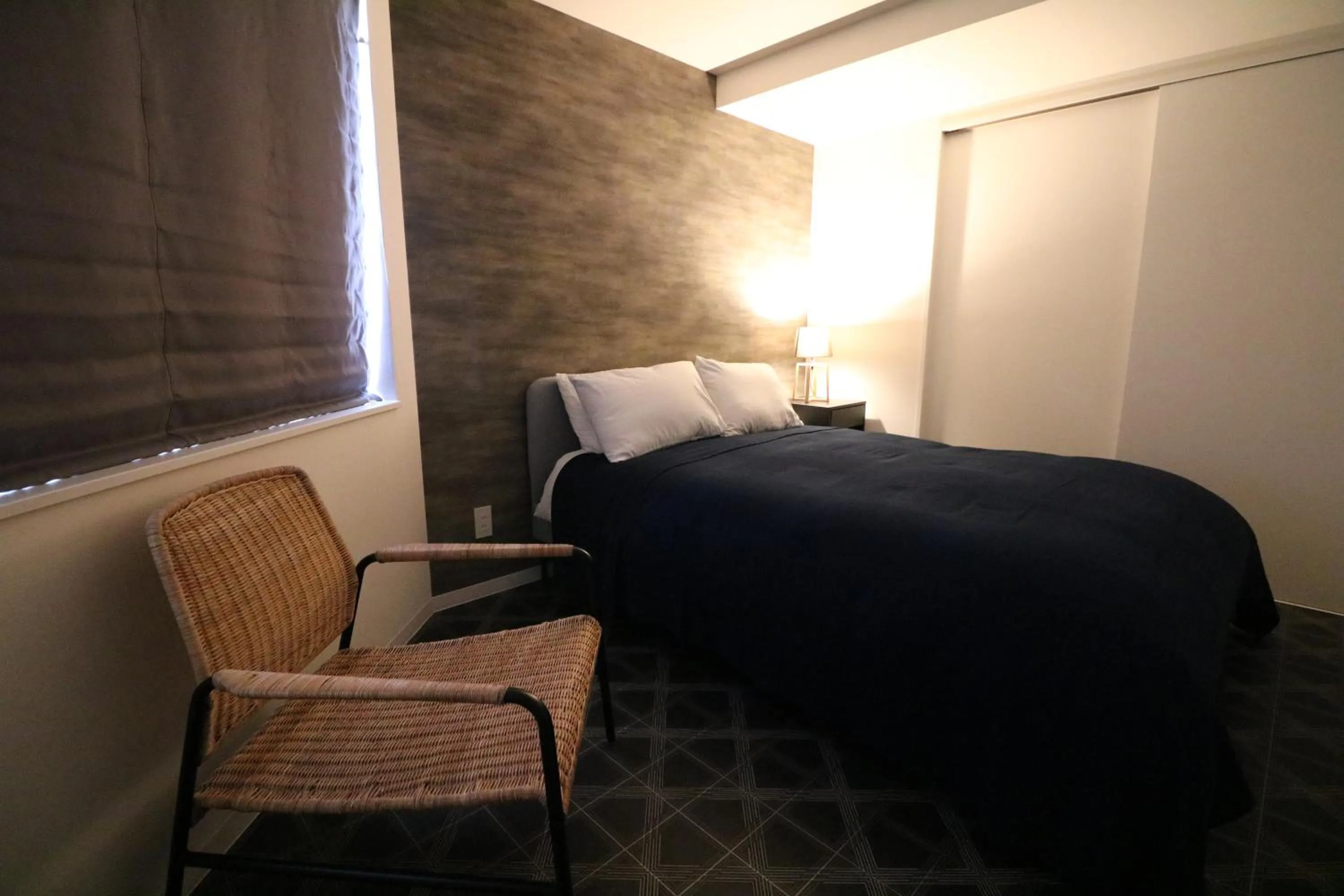 Bed in TAKETO STAY Kotoni