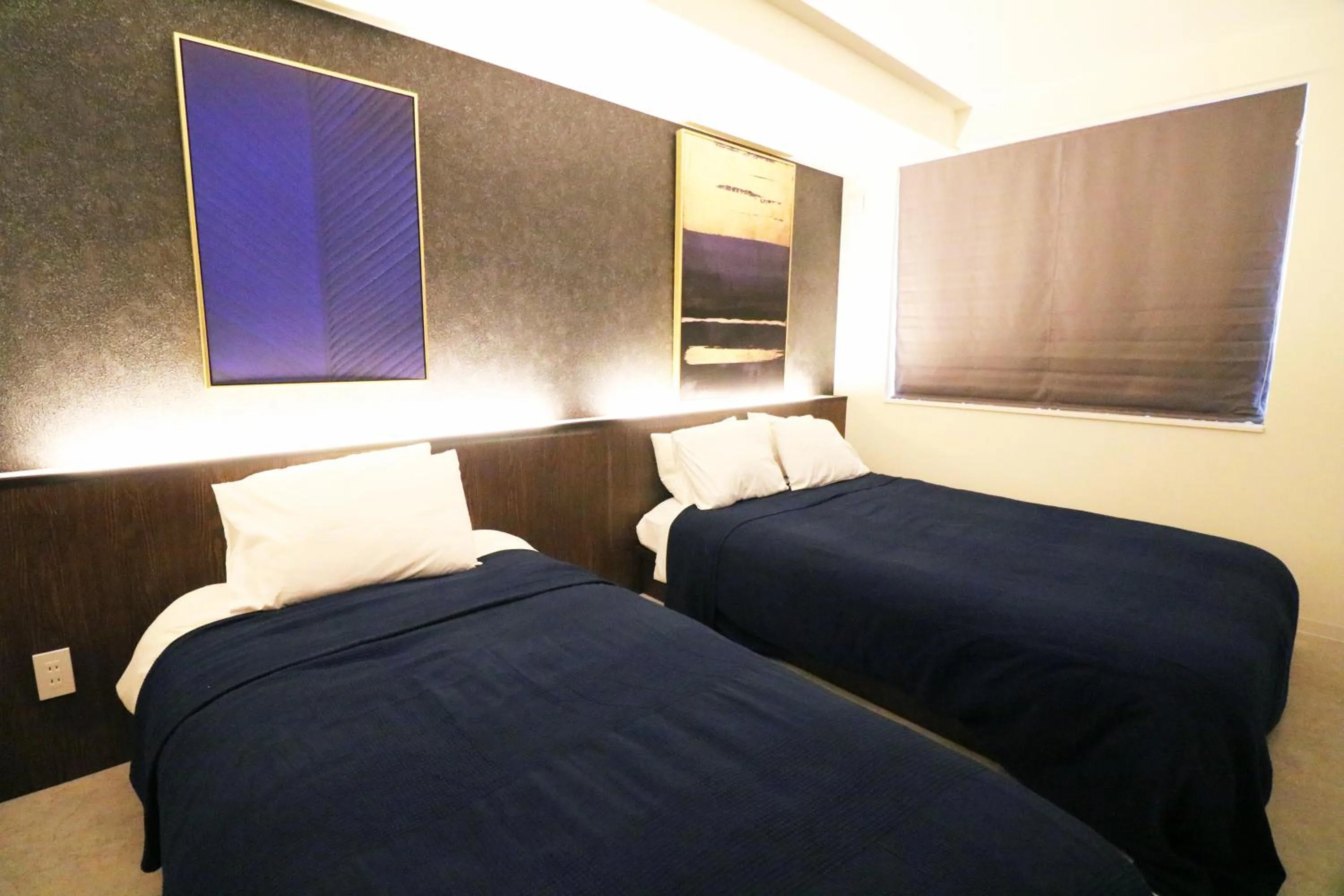 Bed in TAKETO STAY Kotoni