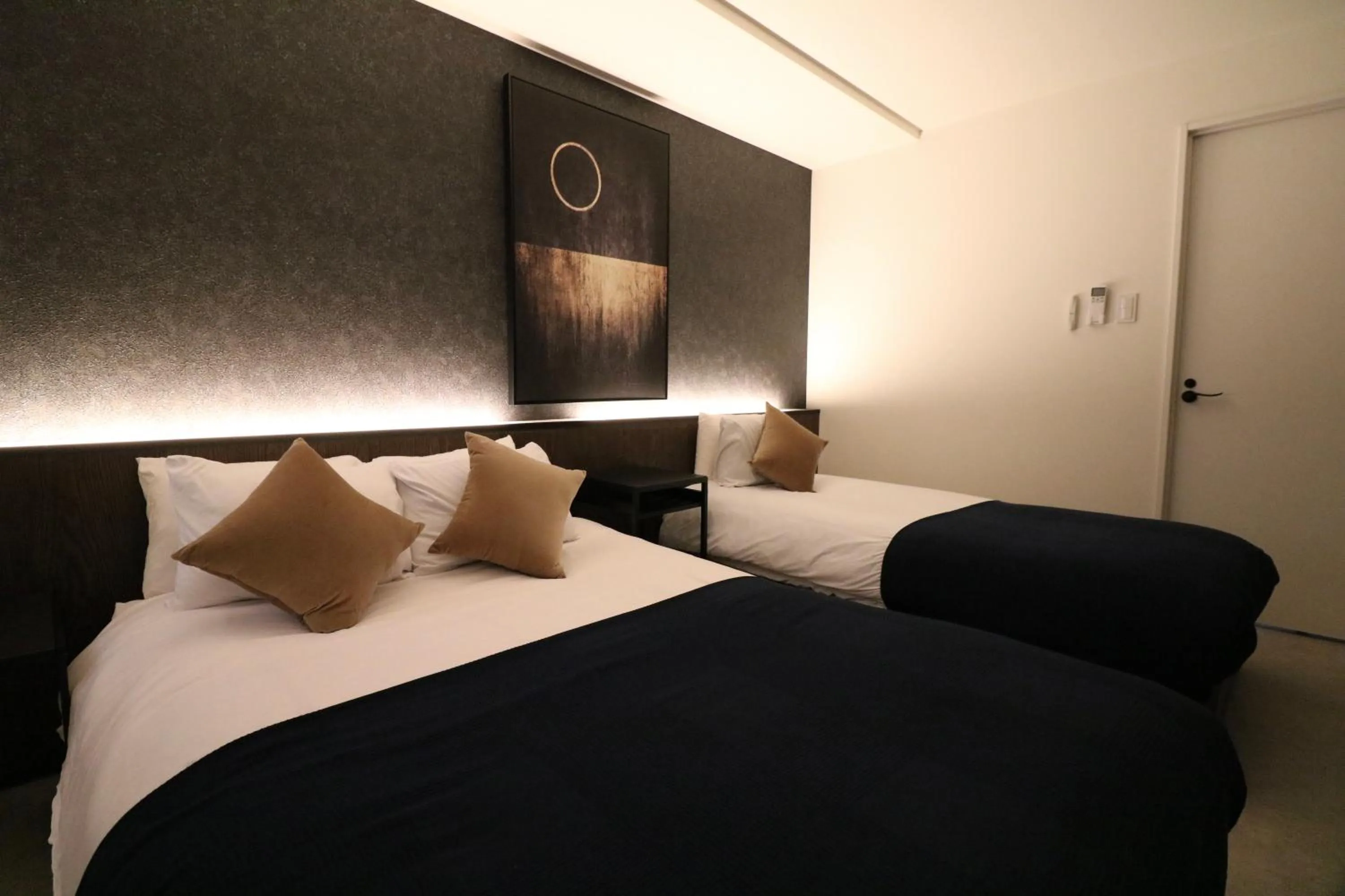 Bed in TAKETO STAY Kotoni