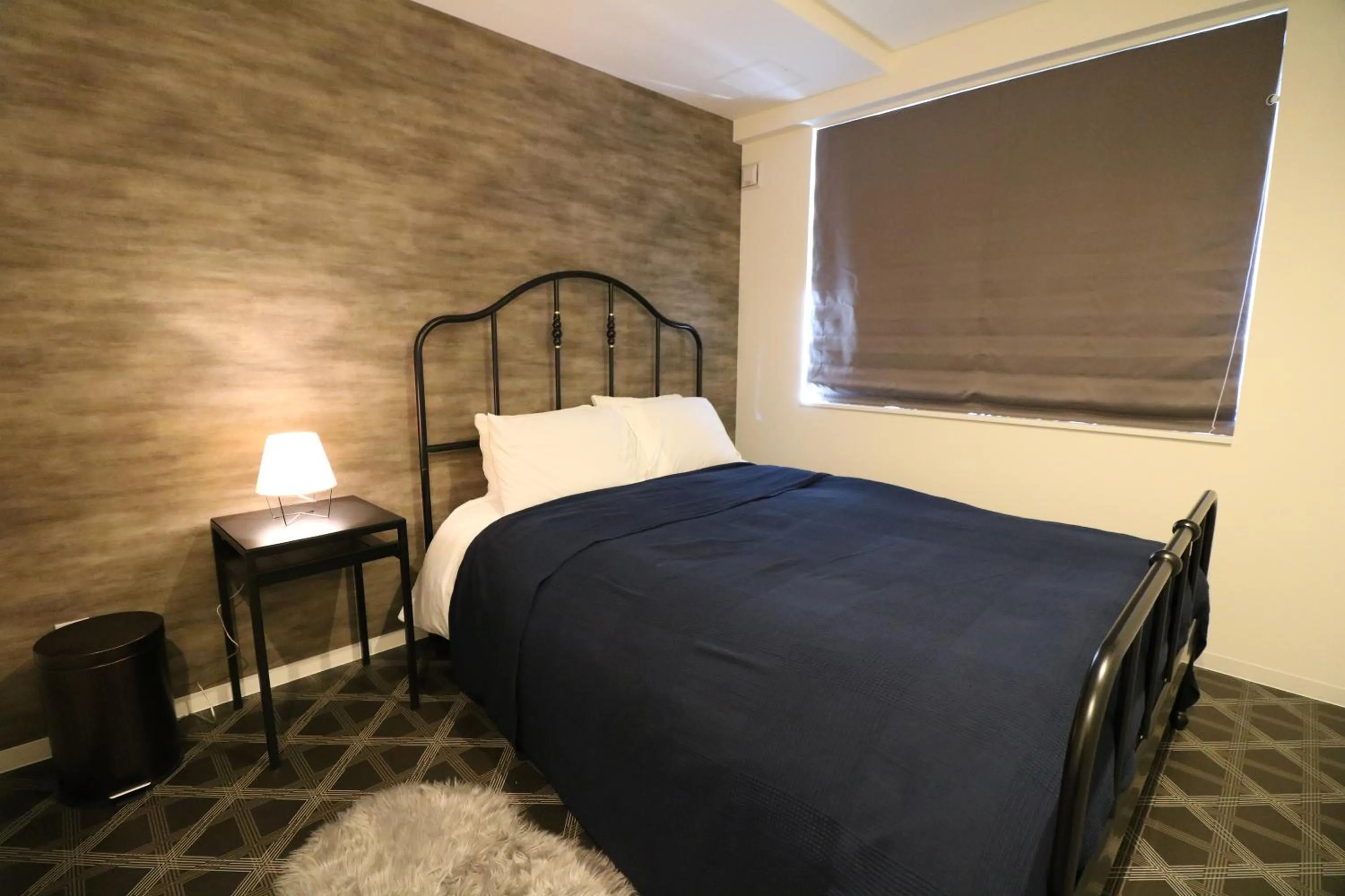 Bed in TAKETO STAY Kotoni