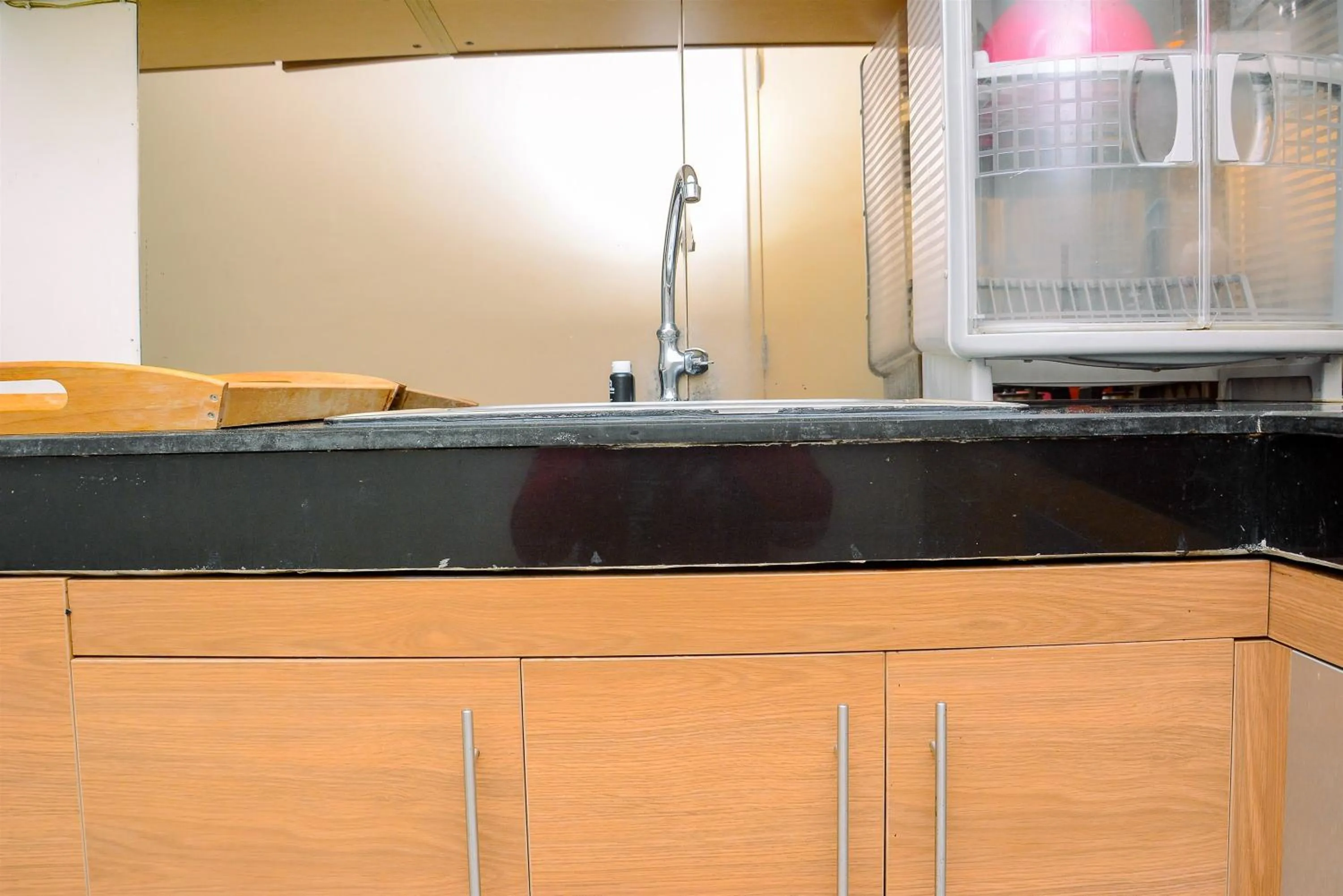 Kitchen or kitchenette in Modern and Luxurious 2BR Essence Dharmawangsa Apartment By Travelio