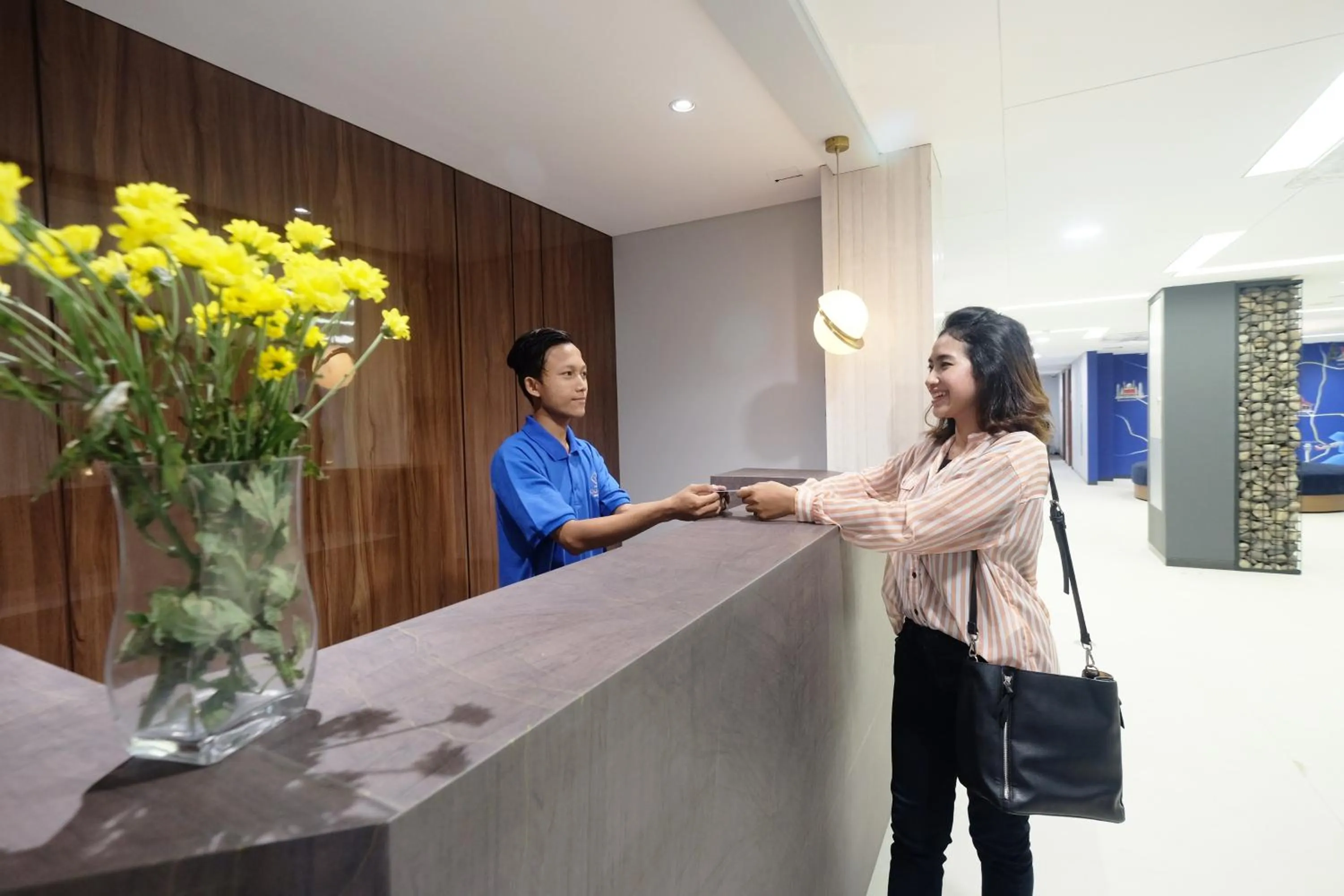 Lobby or reception in Hotel Youstay Semarang by Sinergi