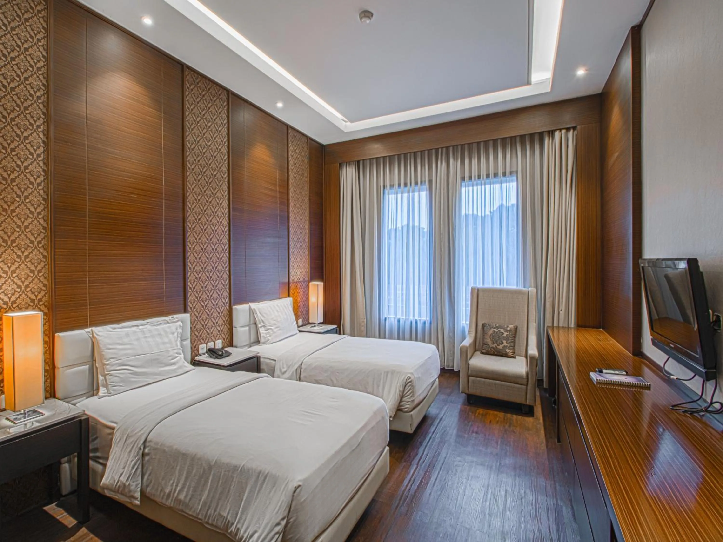 Bed in Grand Arjuna Hotel