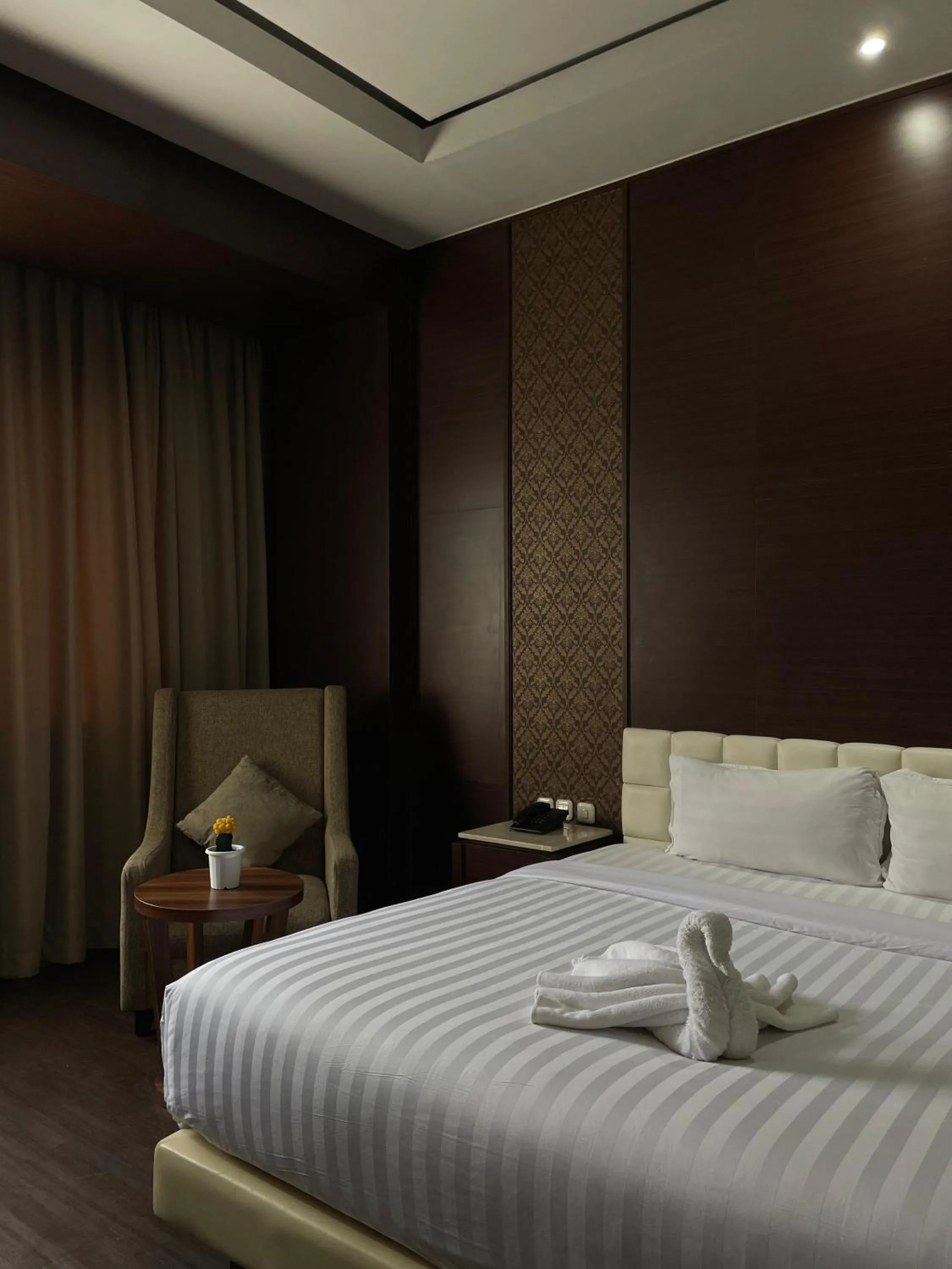 Bed in Grand Arjuna Hotel