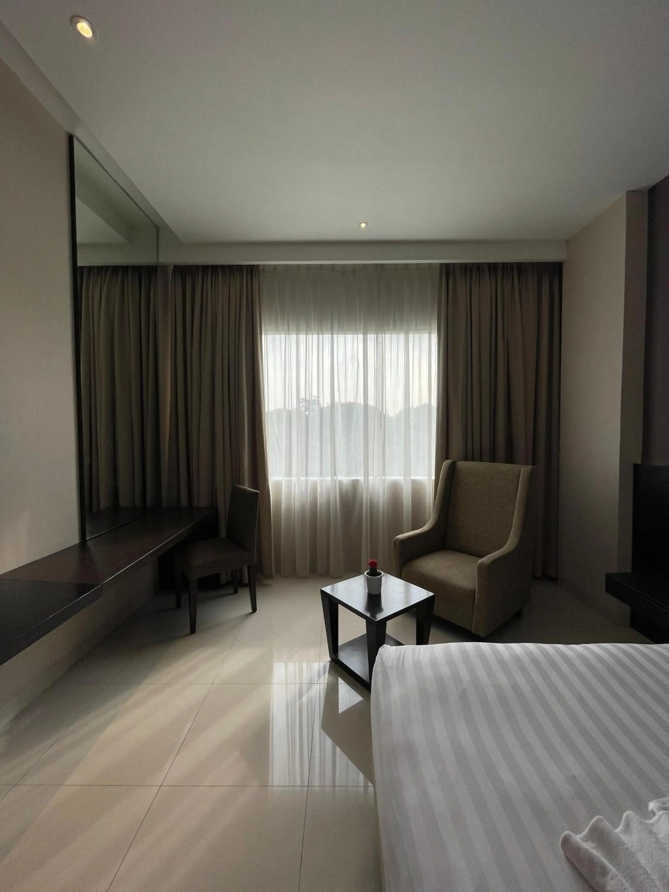 Bed in Grand Arjuna Hotel