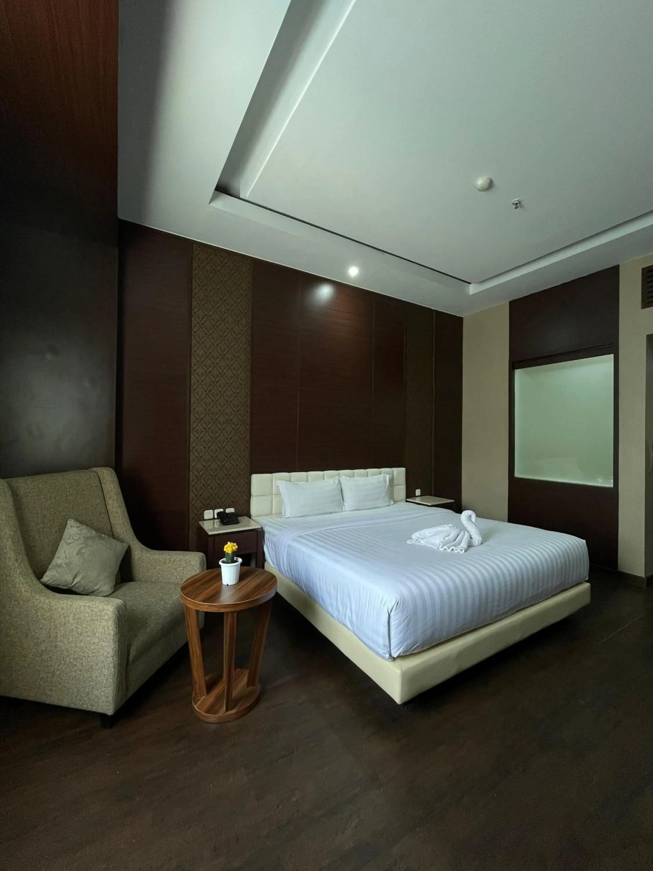 Bed in Grand Arjuna Hotel