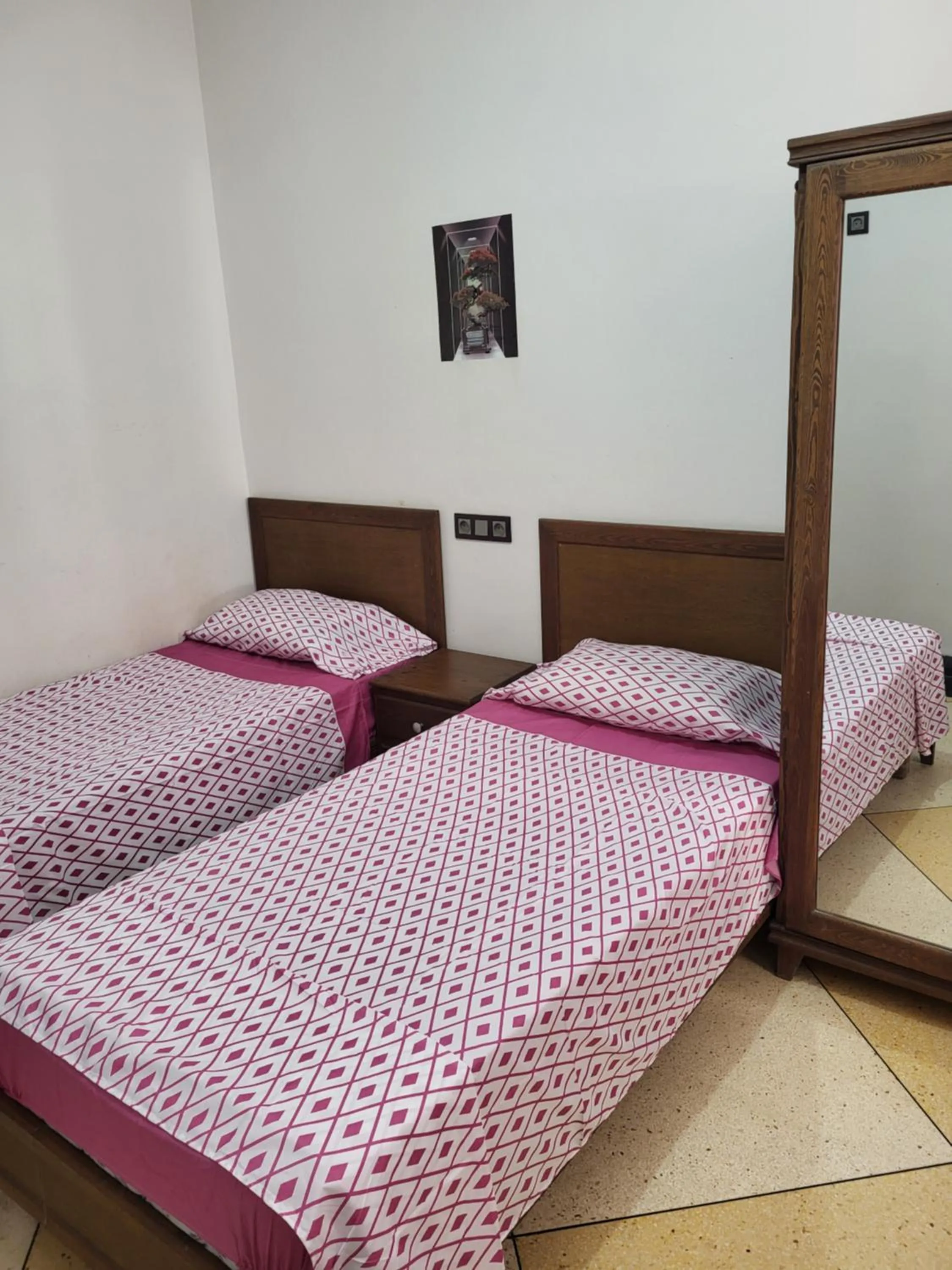 Bed in Hotel El Maghreb Al Kabir