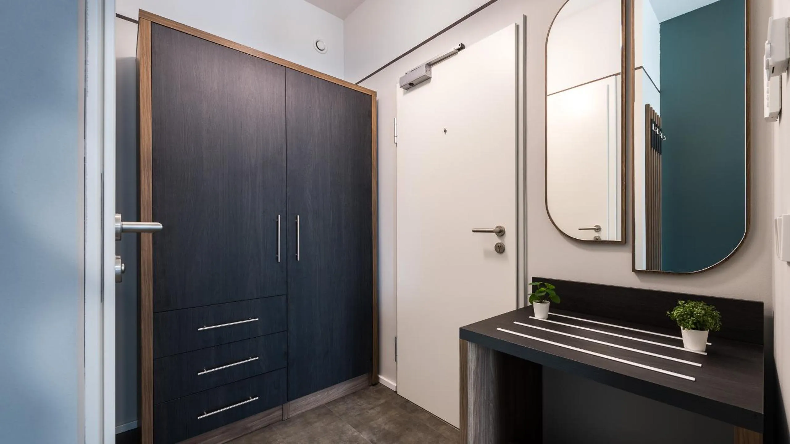 wardrobe in Metropol Apartments & Suites