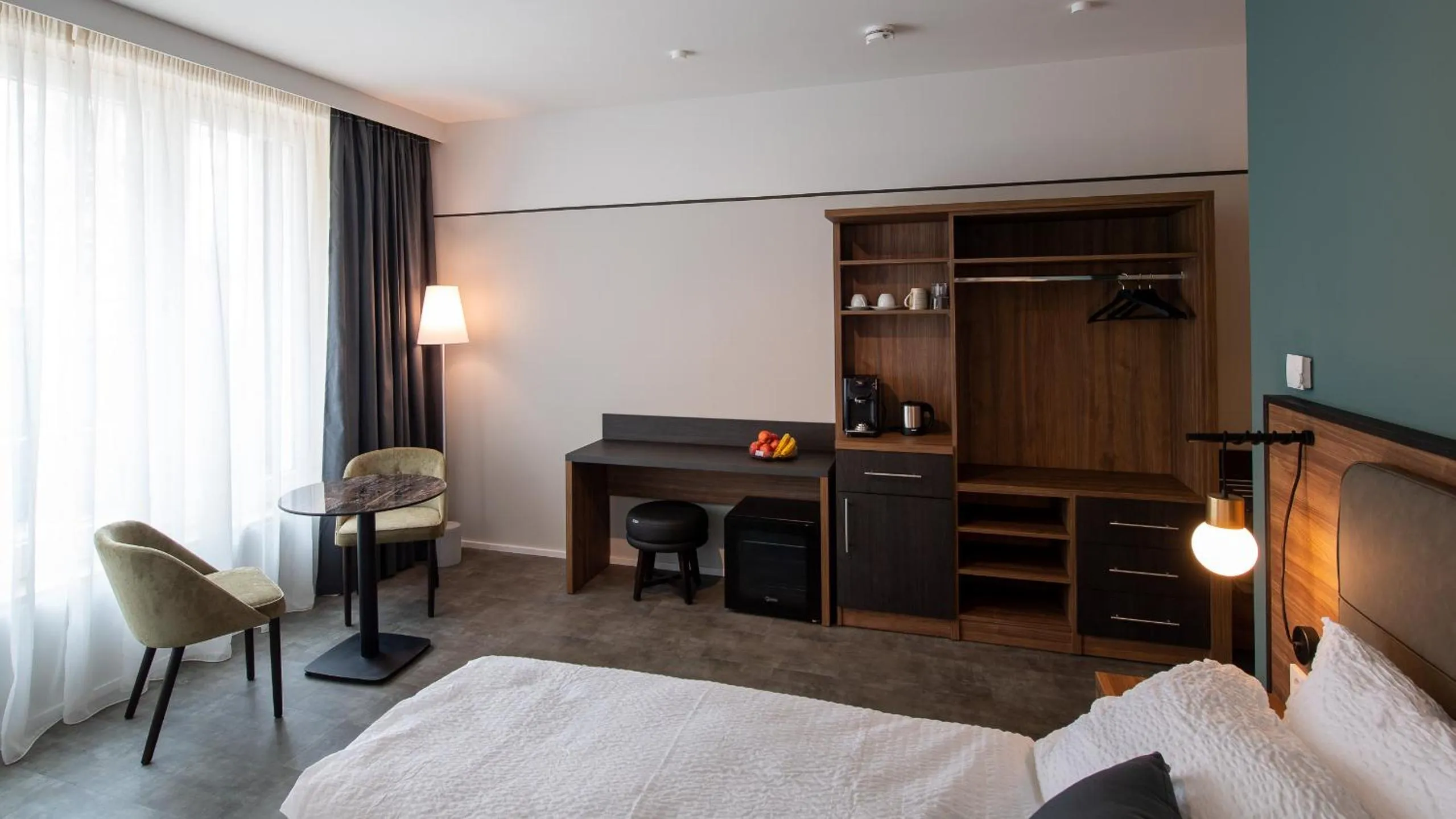 Seating area, Bed in Metropol Apartments & Suites