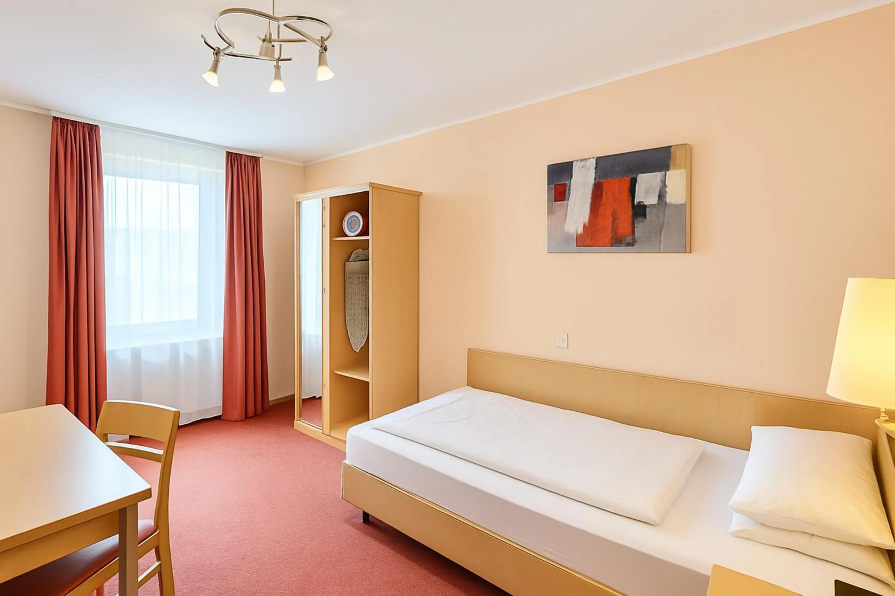 Photo of the whole room, Bed in Atomis Hotel Düsseldorf City