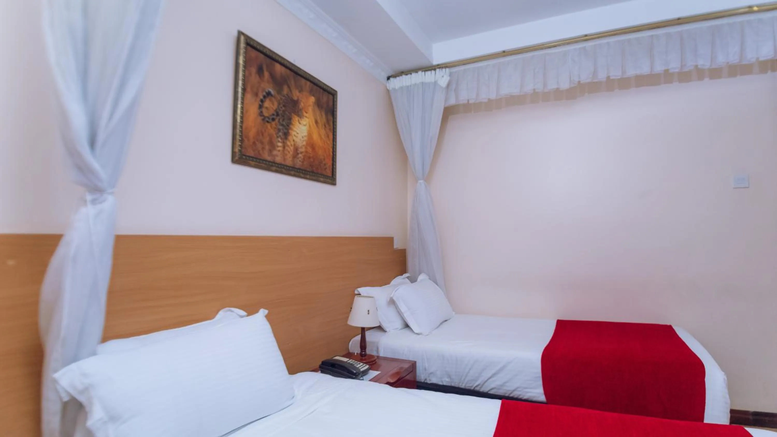 Bed in Longview Suites Hotel