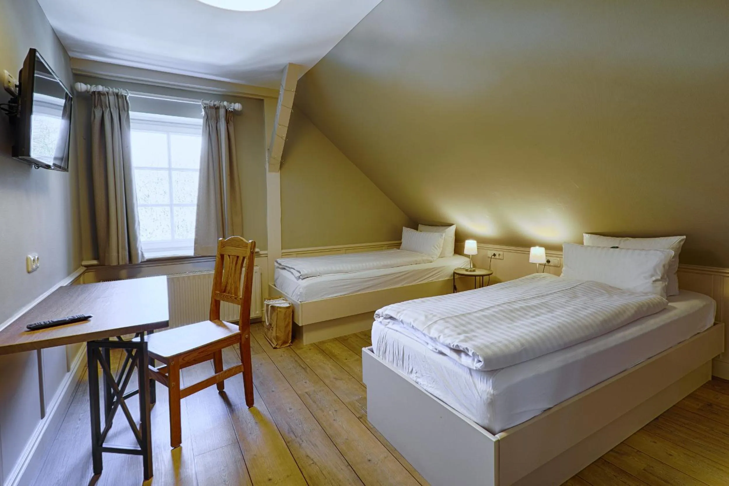 Photo of the whole room, Bed in Meeressterne Hotel Forsthaus Damerow