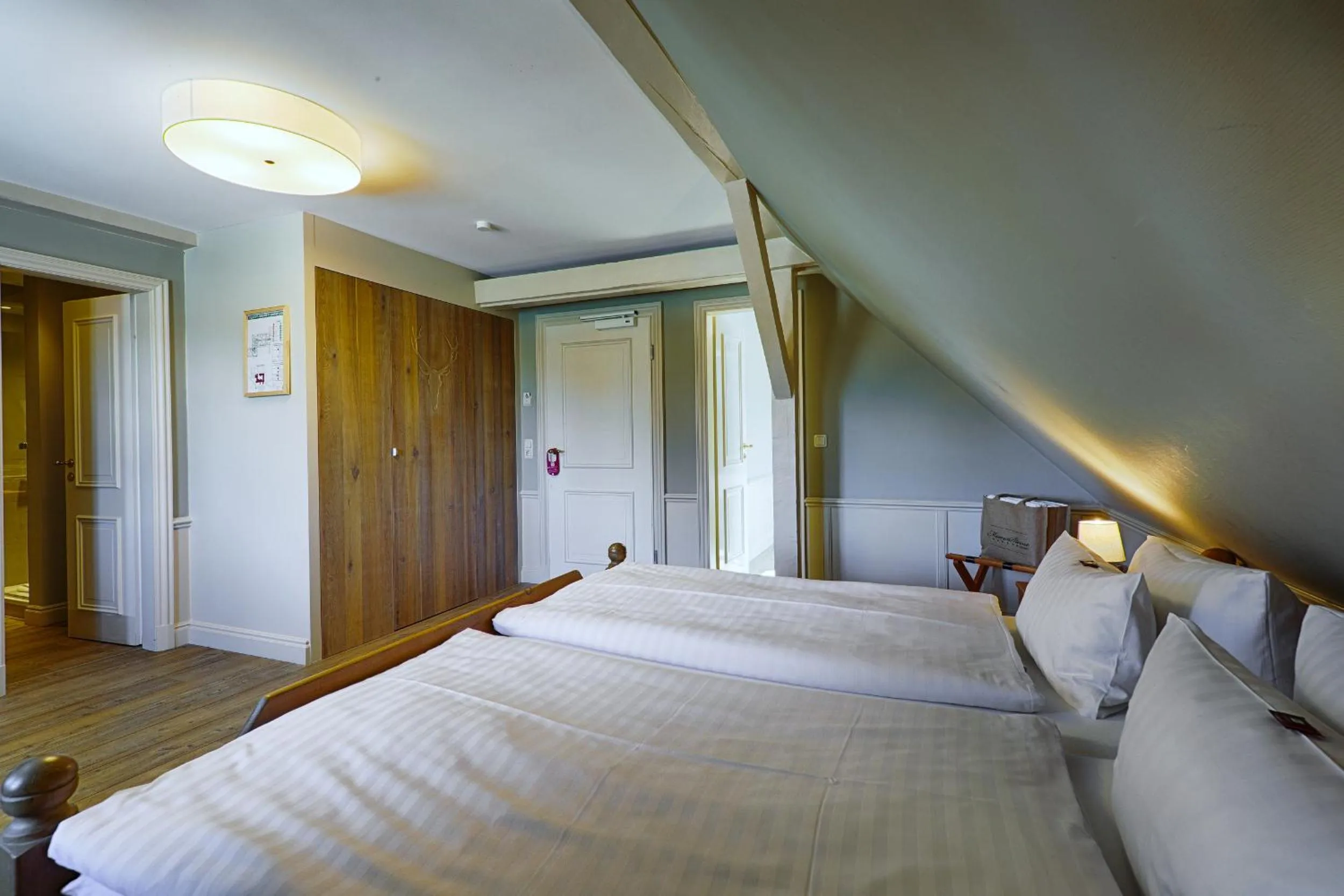 Photo of the whole room, Bed in Meeressterne Hotel Forsthaus Damerow