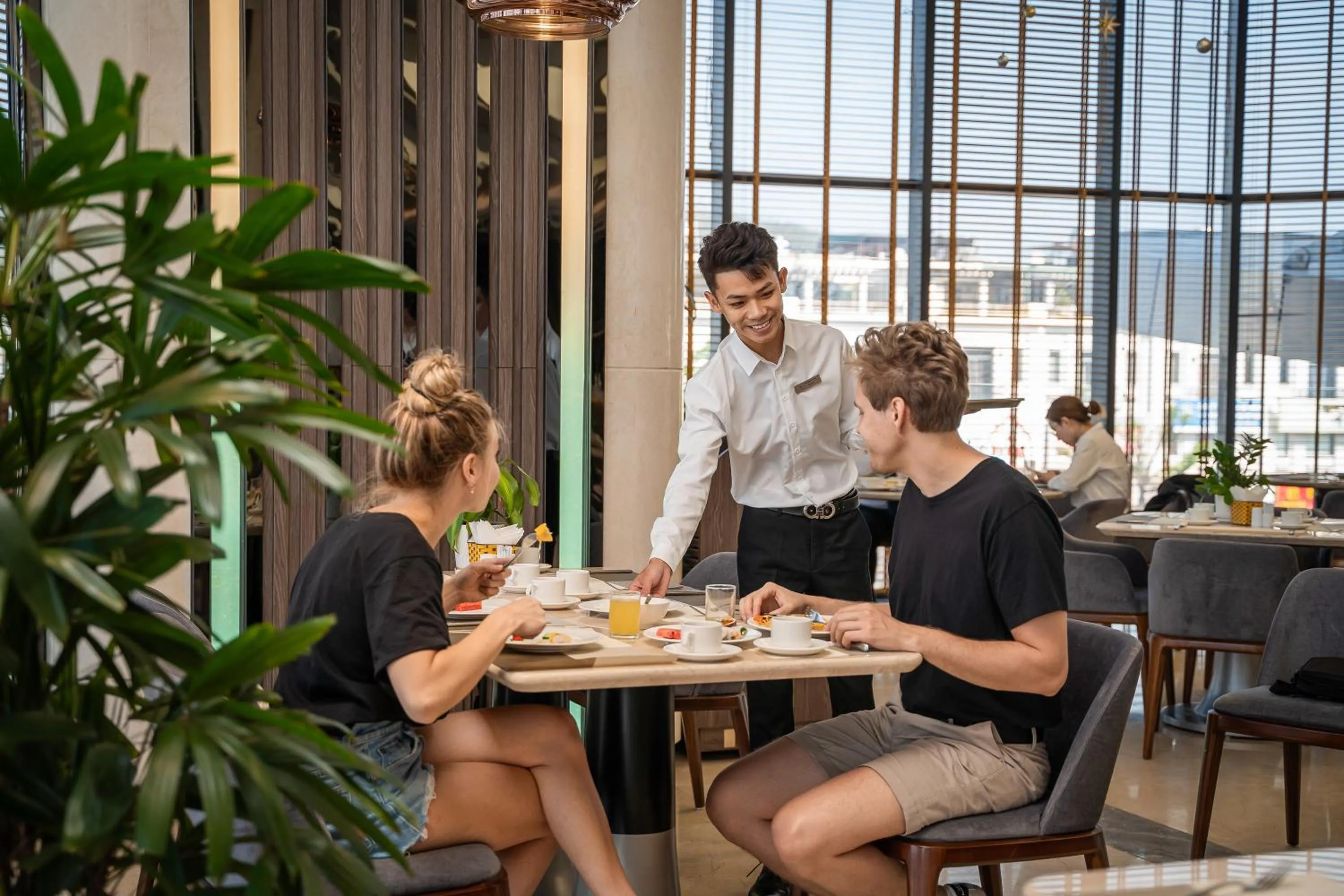 Staff in DeLaSea Ha Long Hotel - Modern Bayview Escape