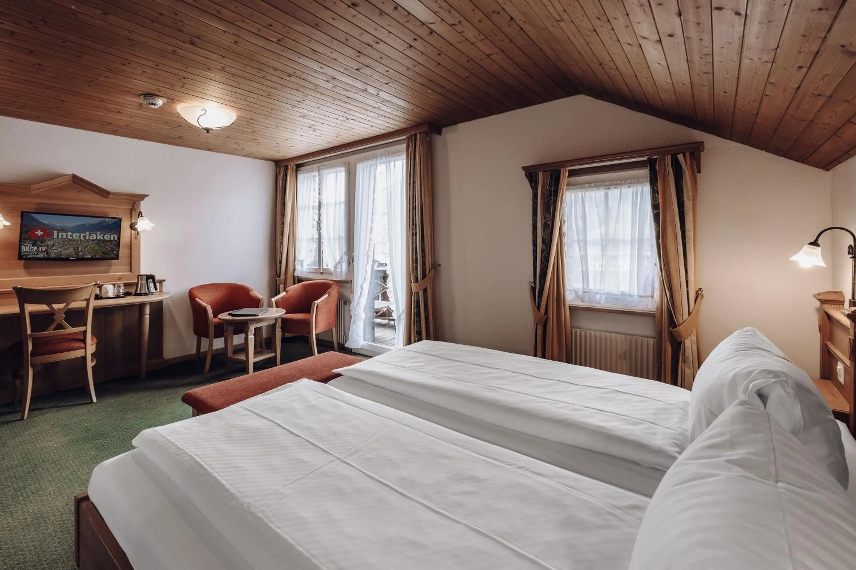 Bed in Hotel Chalet Swiss