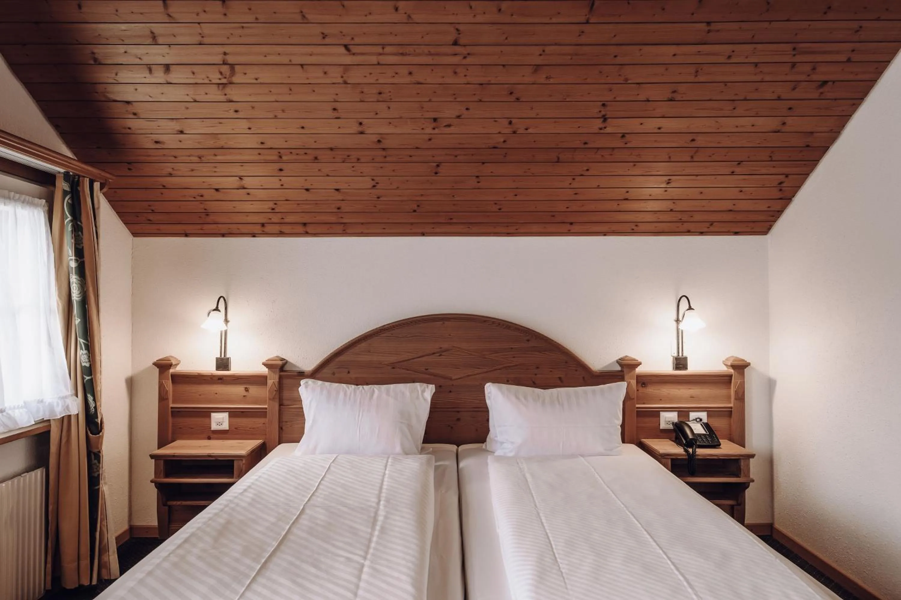 Bed in Hotel Chalet Swiss