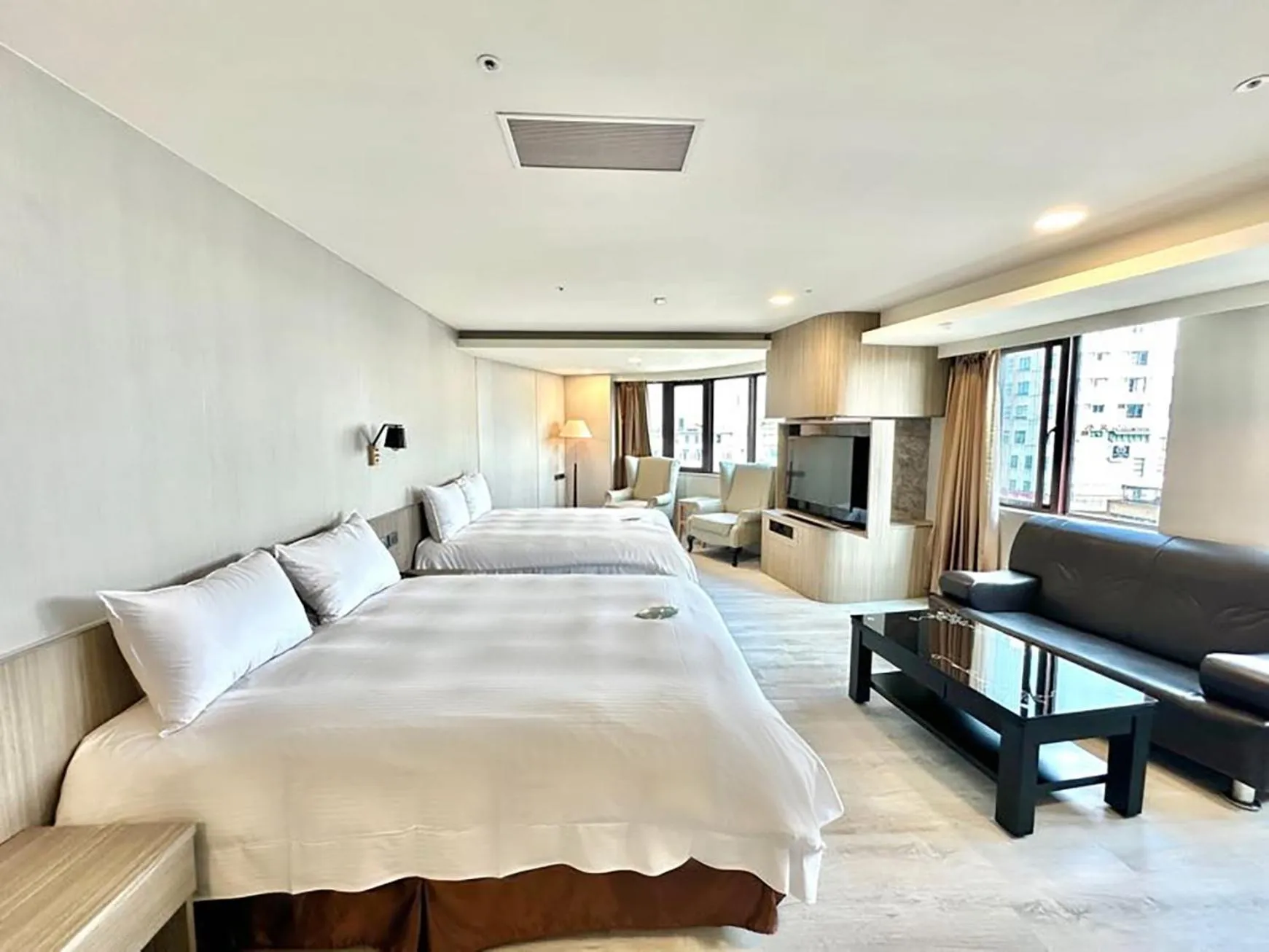 Bed in Grand Earl Hotel