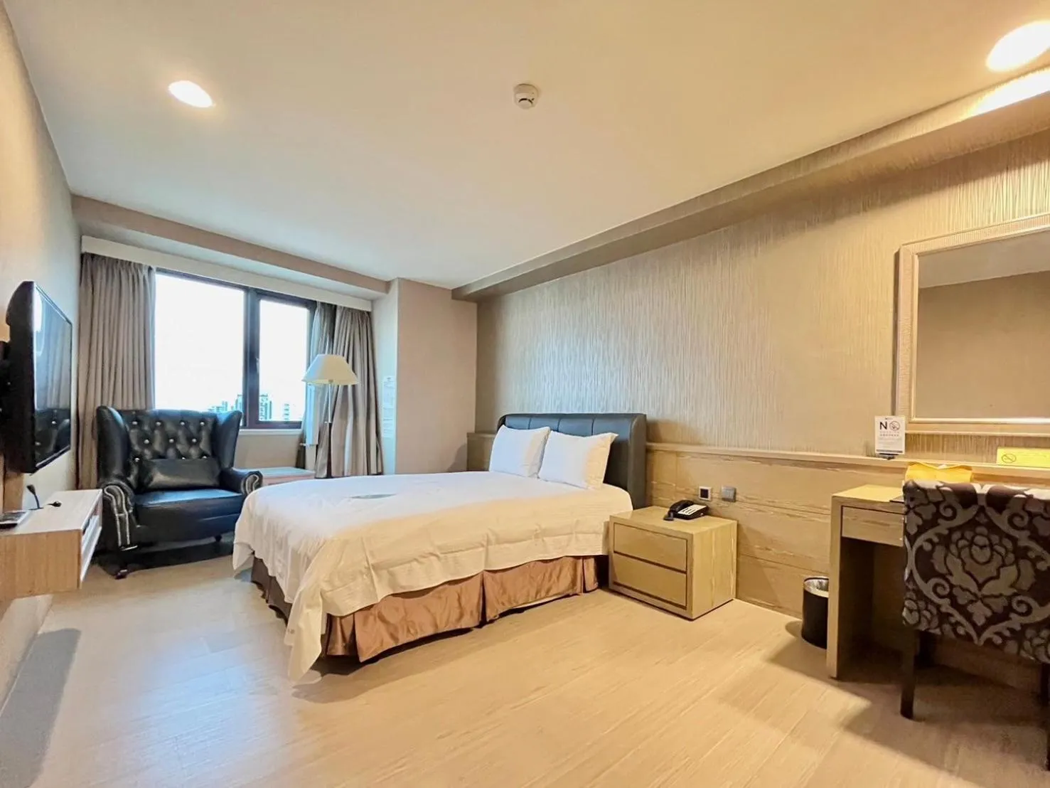 Bed in Grand Earl Hotel