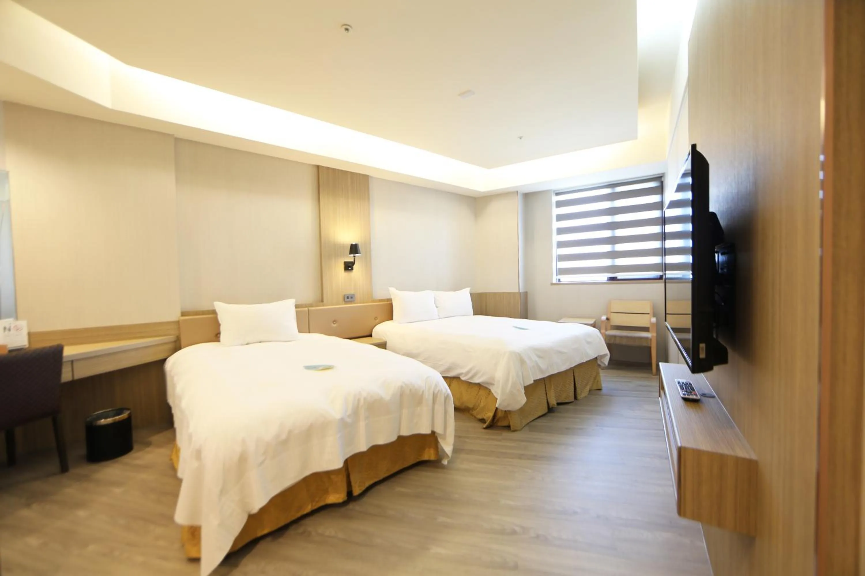 Bed in Grand Earl Hotel