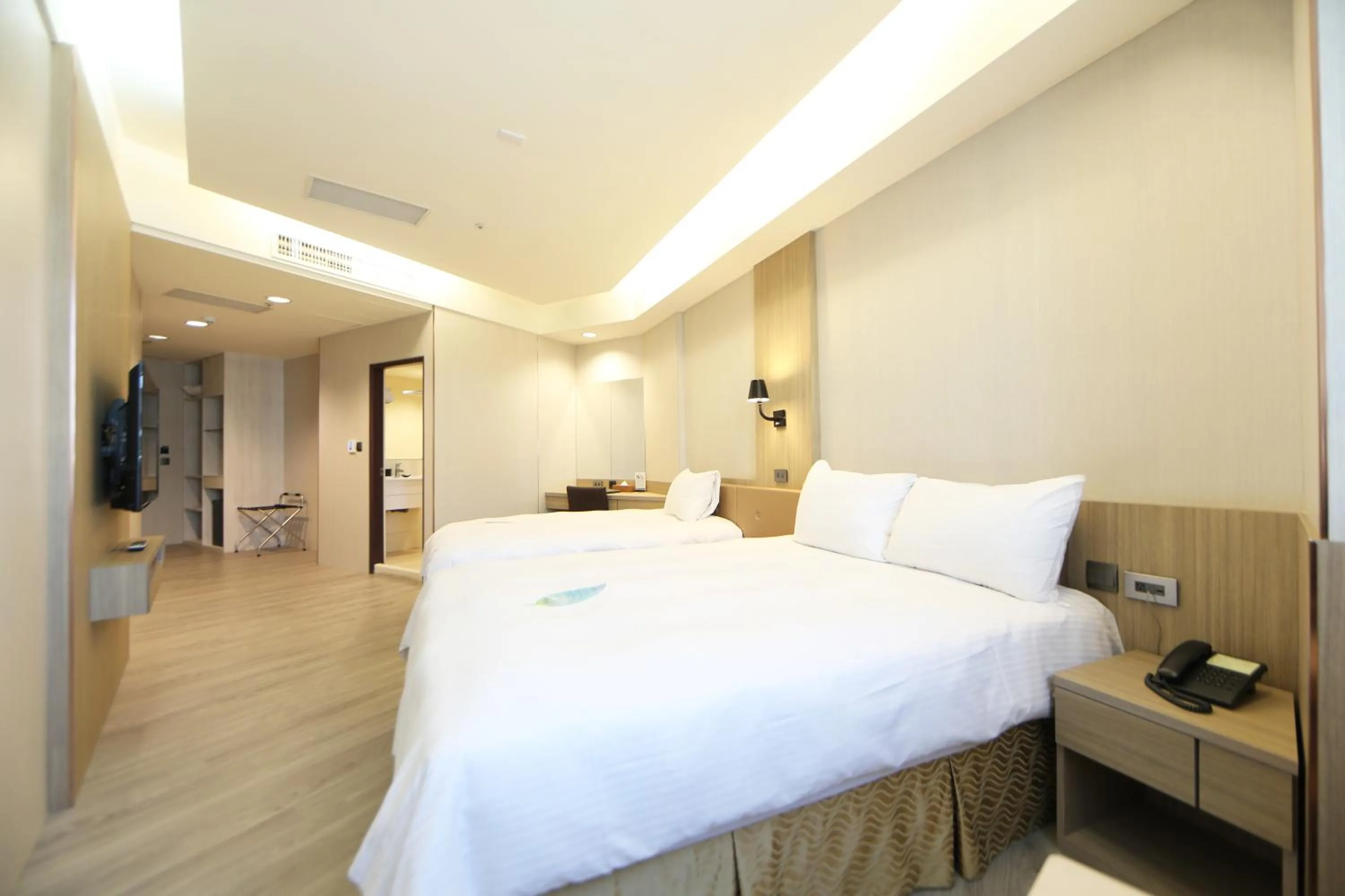 Bed in Grand Earl Hotel