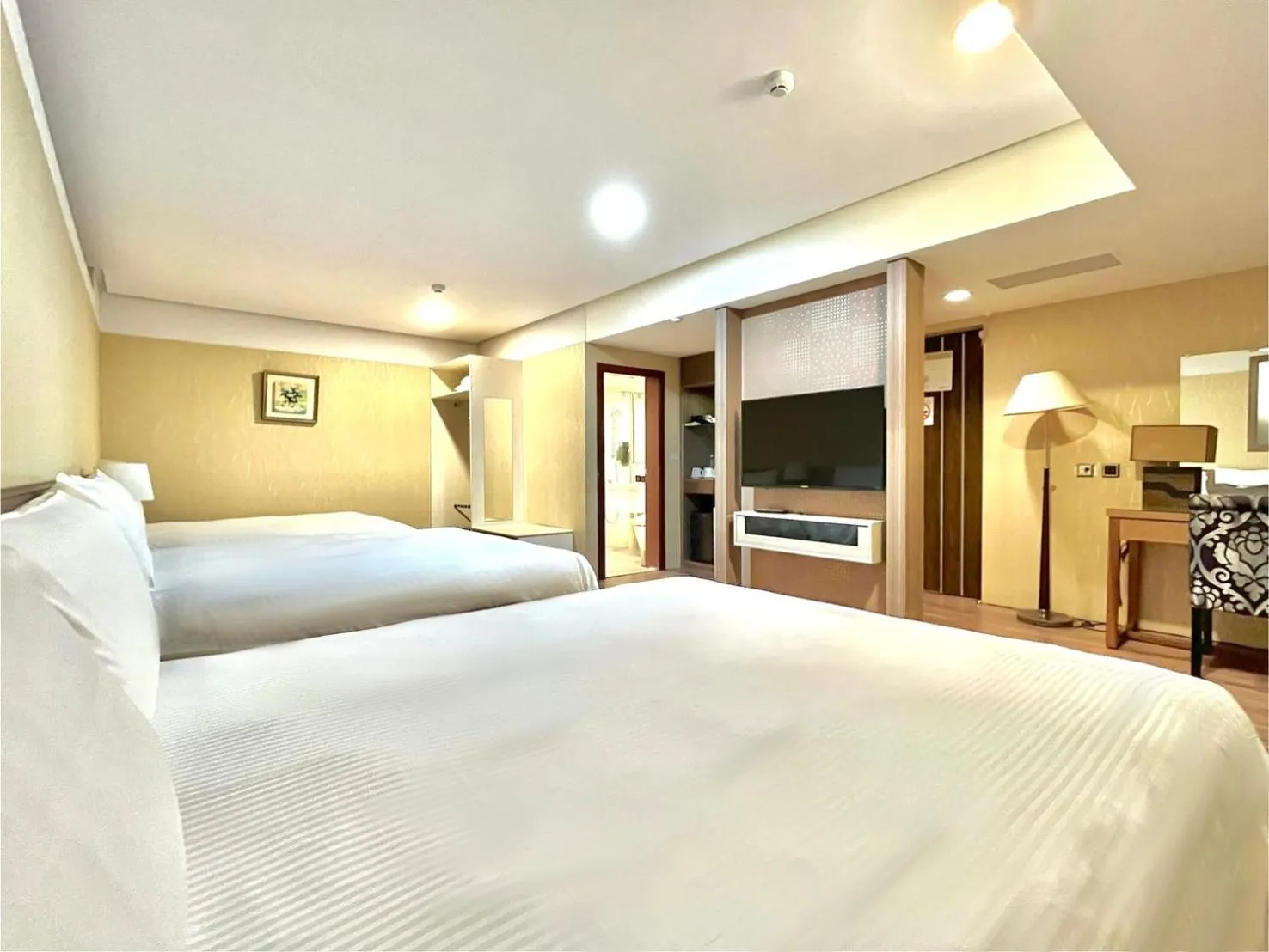 Bed in Grand Earl Hotel