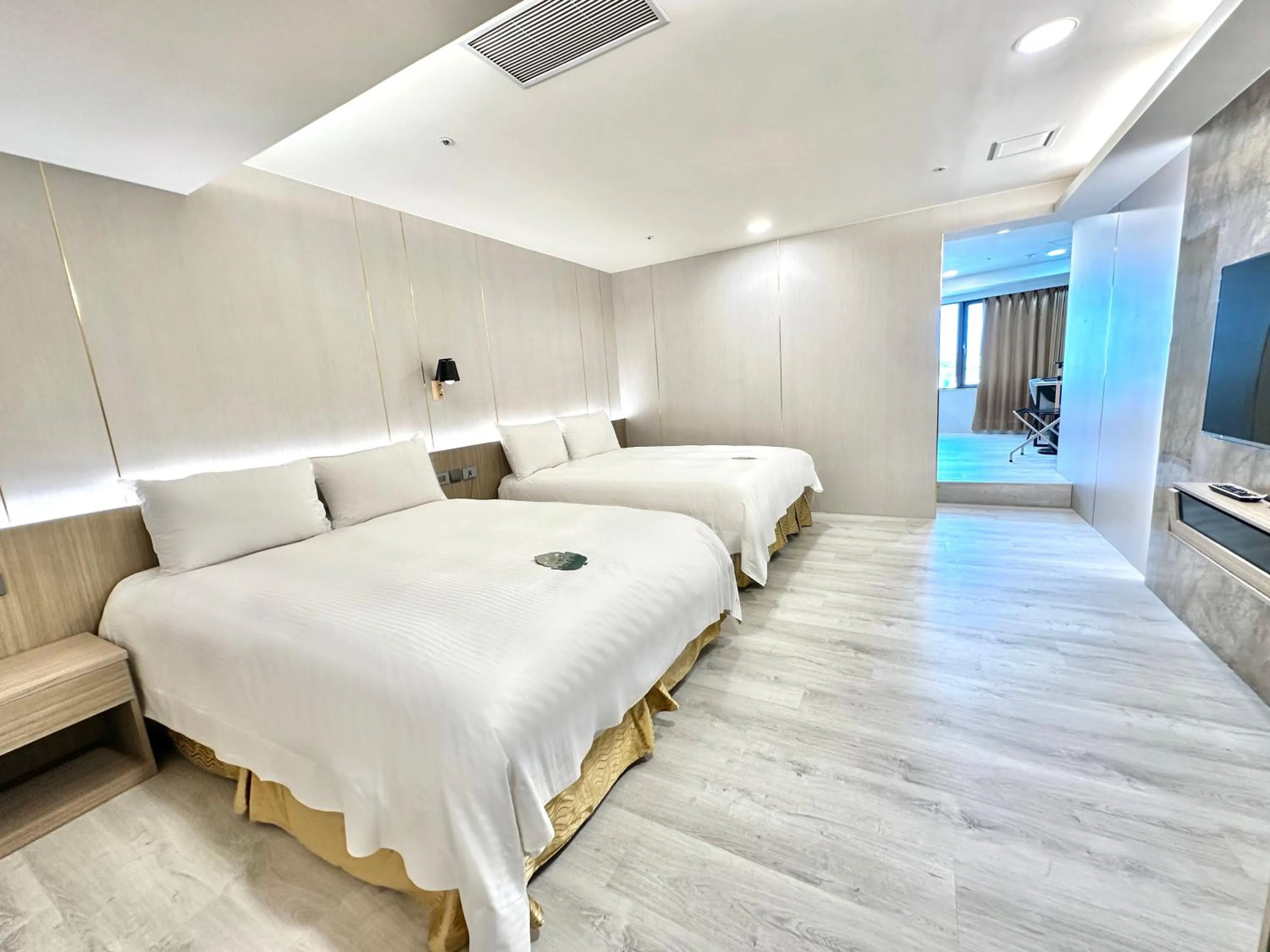 Bed in Grand Earl Hotel