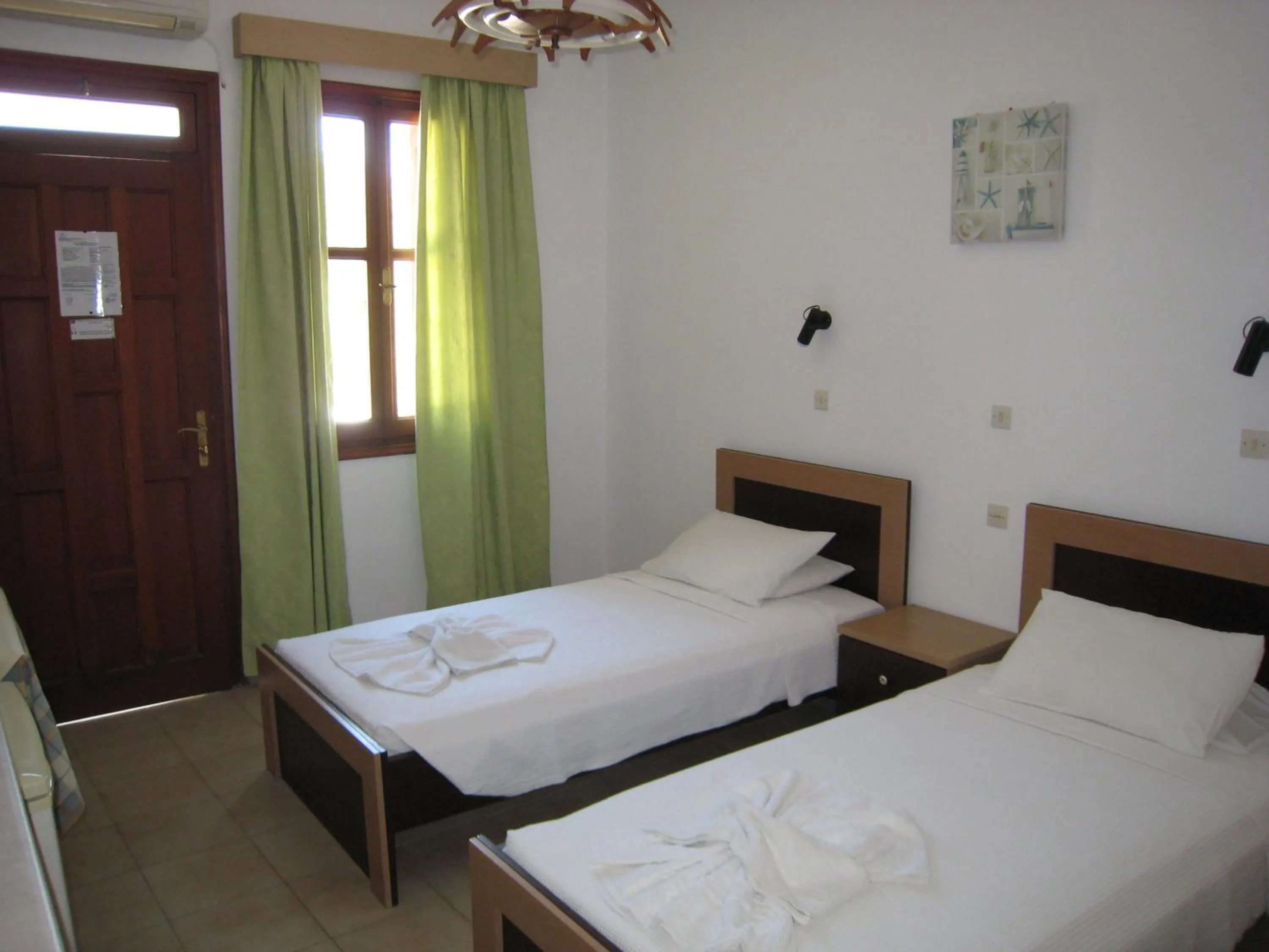 Bed in Eleftheria Lindian Studios II