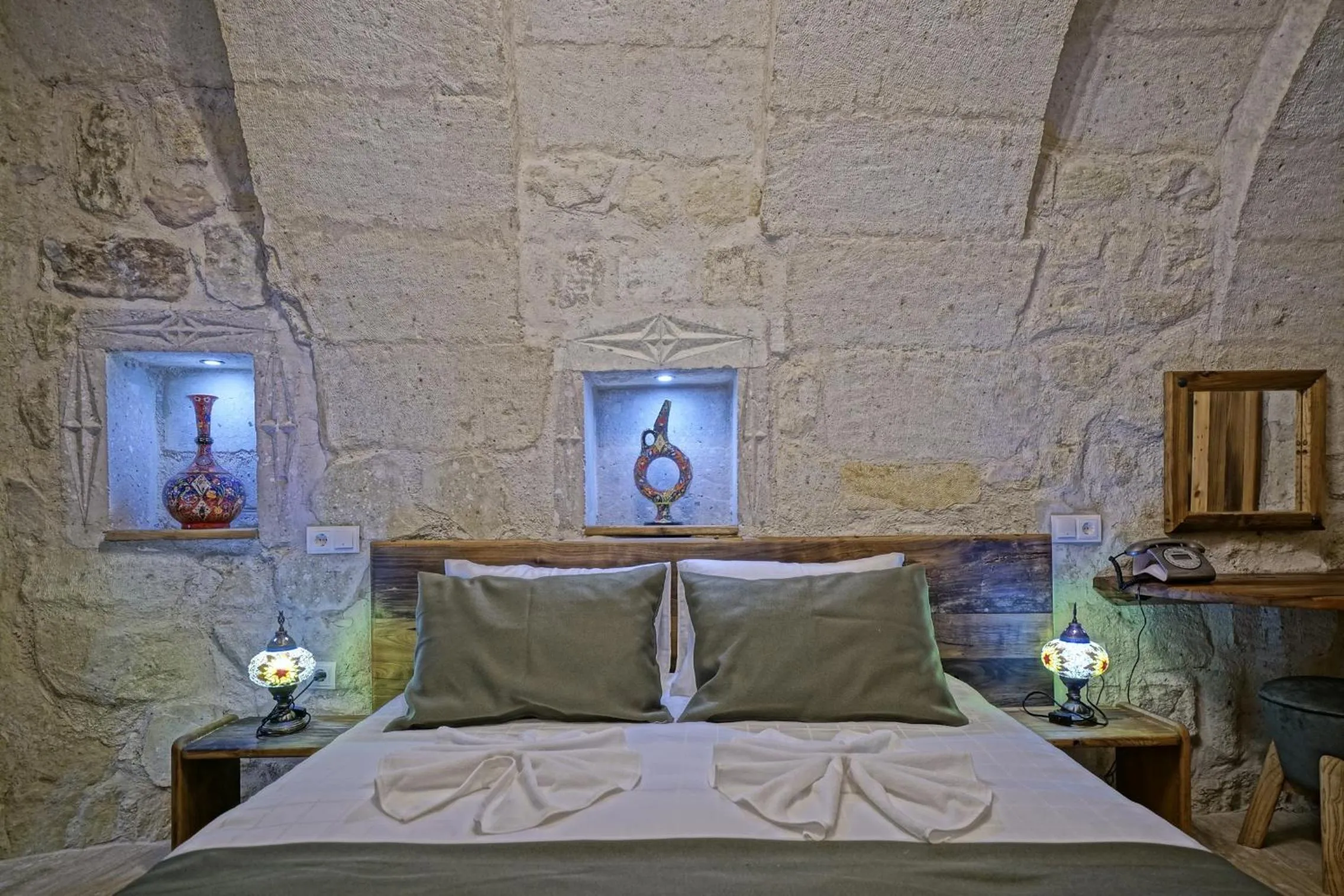 Bed in Vigneron Cave Hotel