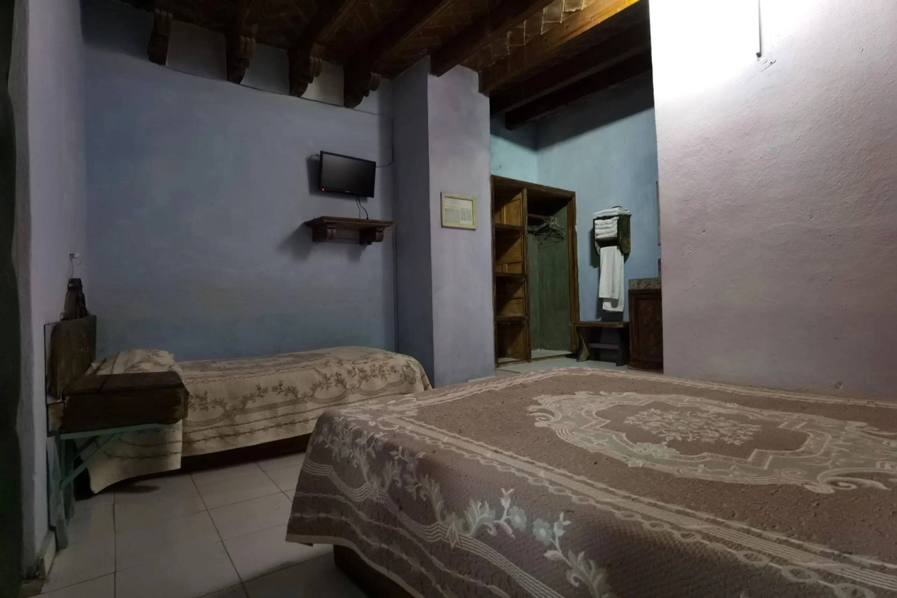 Bedroom in CAPITAL O Meson De La Fragua