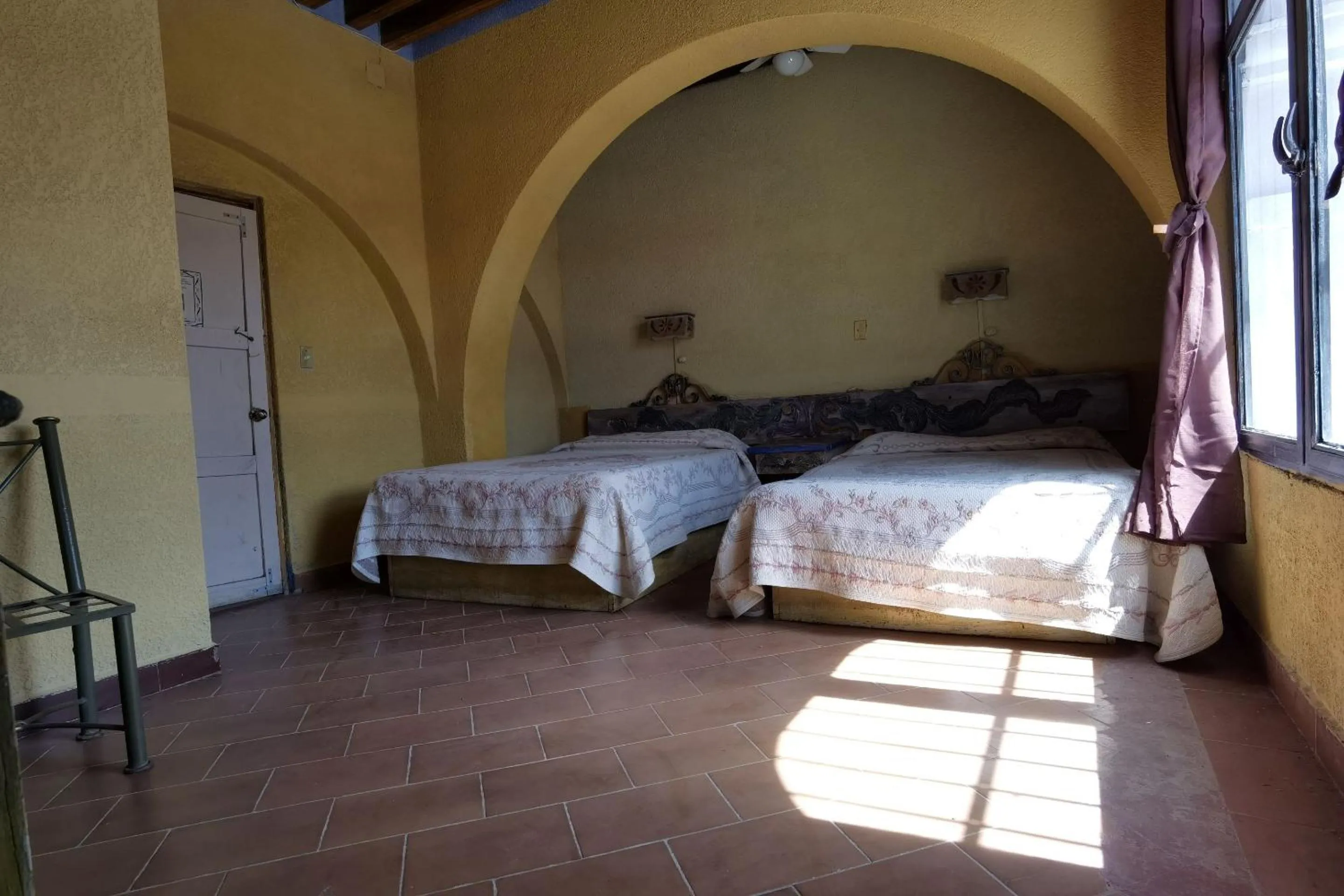 Bedroom in CAPITAL O Meson De La Fragua