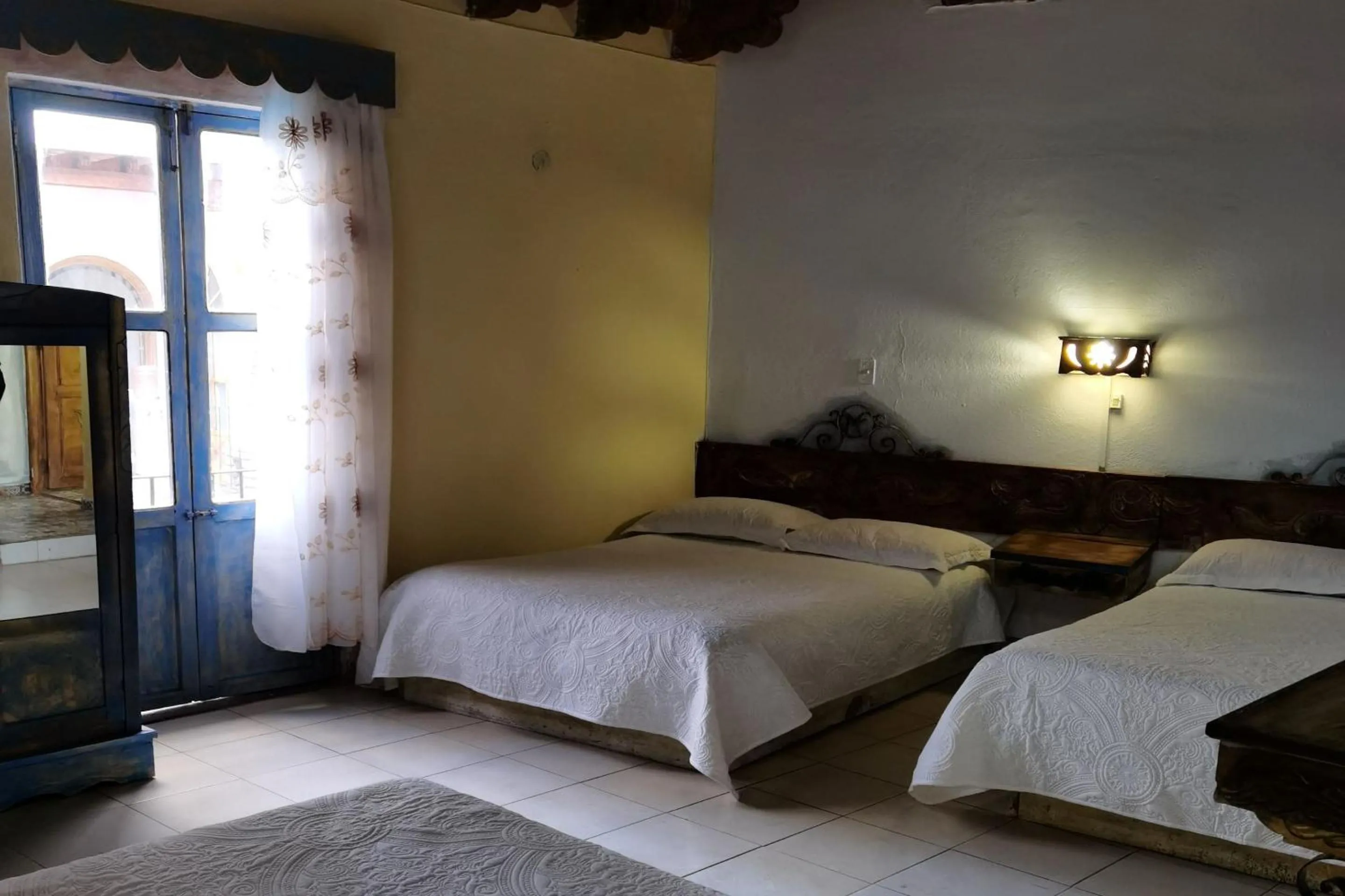 Bedroom in CAPITAL O Meson De La Fragua